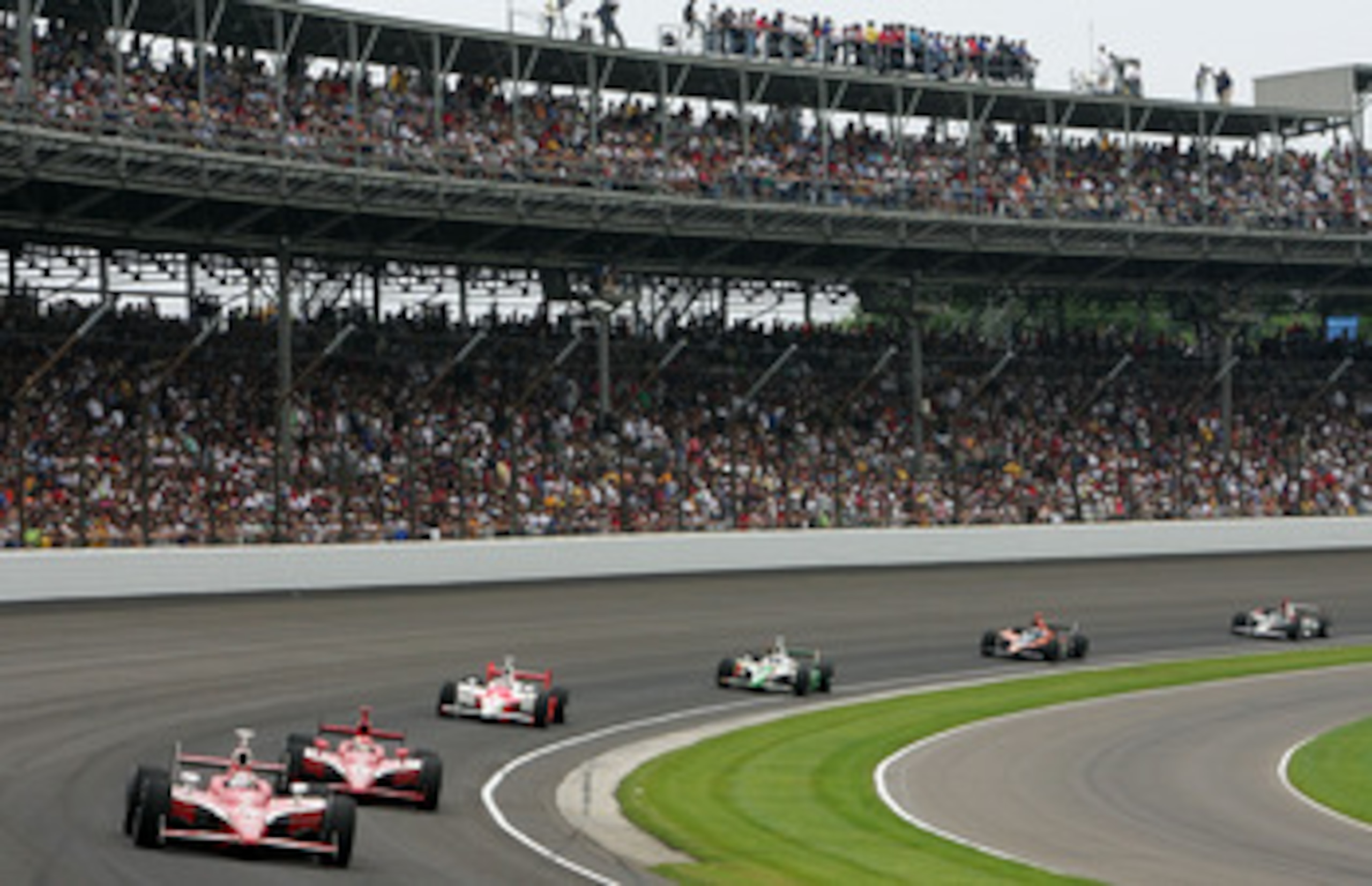 INDIANAPOLIS - MAY 27: Scott Dixon, driver of the #9 Target Chip Ganassi Racing Dallara Honda, leads Dan Wheldon, driver of the #10 Chip Ganassi Racing Dallara Honda and Sam Hornish Jr., driver of the #6 Team Penske Dallara Honda, during the IRL IndyCar INDIANAPOLIS - MAY 27: Scott Dixon, driver of the #9 Target Chip Ganassi Racing Dallara Honda, leads Dan Wheldon, driver of the #10 Chip Ganassi Racing Dallara Honda and Sam Hornish Jr., driver of the #6 Team Penske Dallara Honda, during the IRL IndyCar