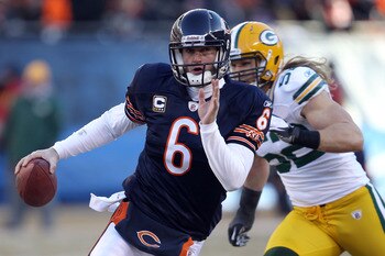 CHICAGO, IL - JANUARY 23:  Quarterback Jay Cutler #6 of the Chicago Bears runs the ball ahead of Clay Matthews #52 of the Green Bay Packers in the second quarter of the NFC Championship Game at Soldier Field on January 23, 2011 in Chicago, Illinois.  (Pho