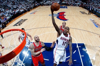 ATLANTA, GA - MAY 12: Jamal Crawford #11 of the Atlanta Hawks drives the basket against Carlos Boozer #5 of the Chicago Bulls in Game Six of the Eastern Conference Semifinals in the 2011 NBA Playoffs at Phillips Arena on May 12, 2011 in Atlanta, Georgia. ATLANTA, GA - MAY 12: Jamal Crawford #11 of the Atlanta Hawks drives the basket against Carlos Boozer #5 of the Chicago Bulls in Game Six of the Eastern Conference Semifinals in the 2011 NBA Playoffs at Phillips Arena on May 12, 2011 in Atlanta, Georgia.