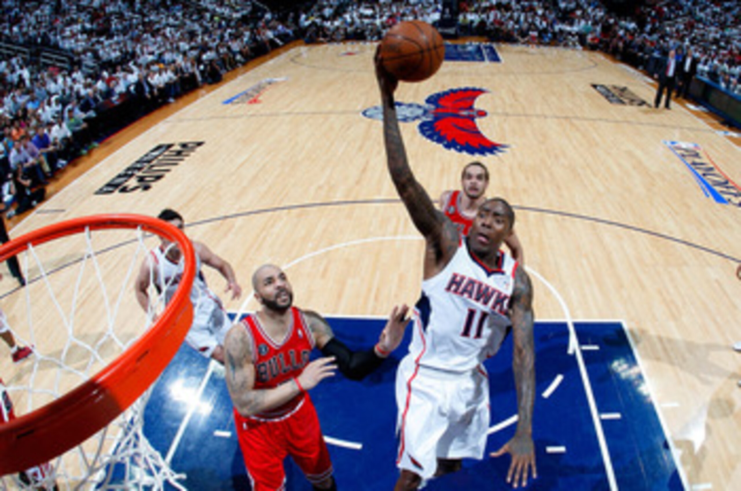 ATLANTA, GA - MAY 12:  Jamal Crawford #11 of the Atlanta Hawks drives the basket against Carlos Boozer #5 of the Chicago Bulls in Game Six of the Eastern Conference Semifinals in the 2011 NBA Playoffs at Phillips Arena on May 12, 2011 in Atlanta, Georgia.