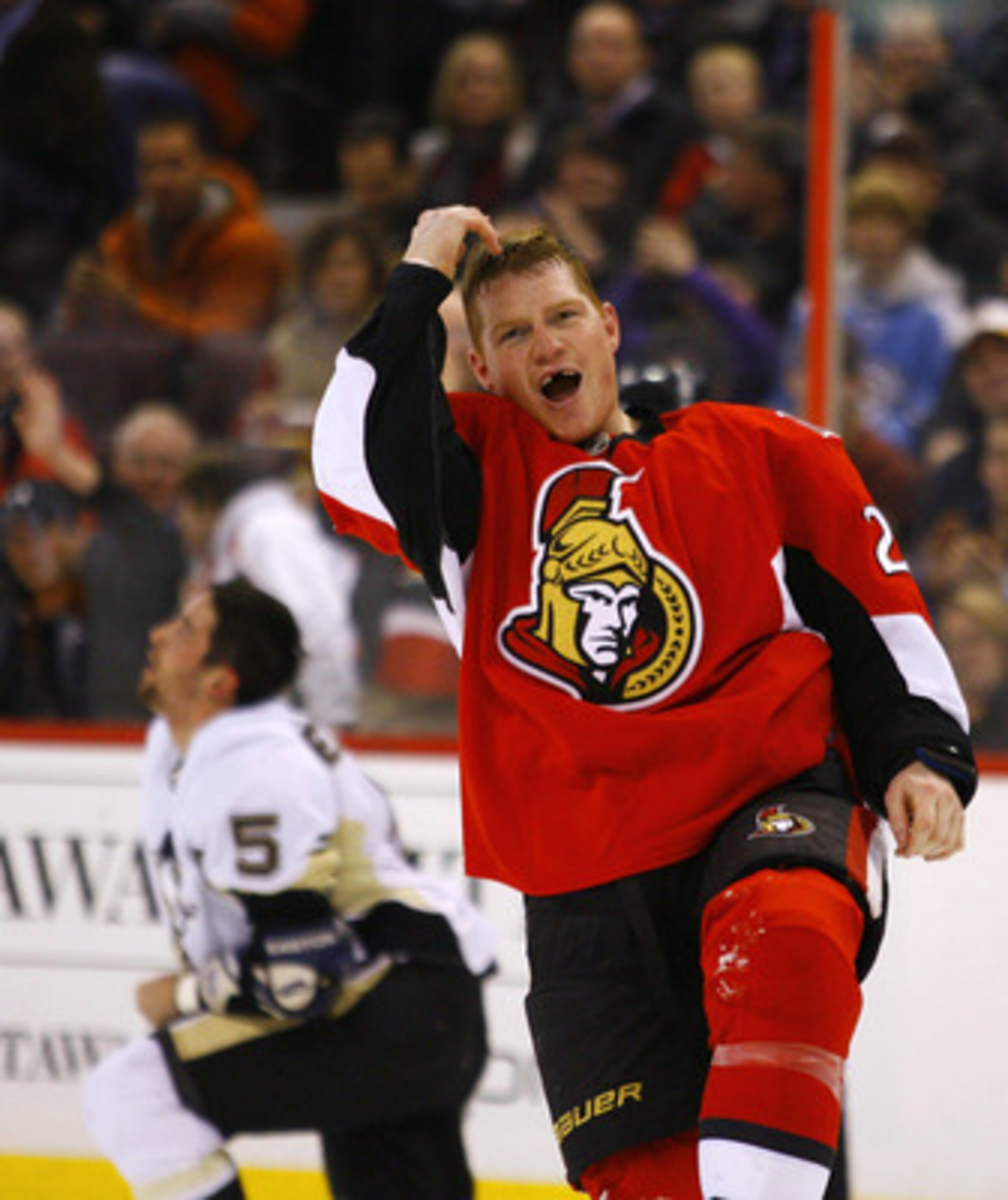 OTTAWA, CANADA - MARCH 15:  Chris Neil #25 of the Ottawa Senators gestures to the crowd after a fight with Deryk Engelland #5 of the Pittsburgh Penguins during a game at Scotiabank Place on March 15, 2011 in Ottawa, Canada.  (Photo by Phillip MacCallum/Ge