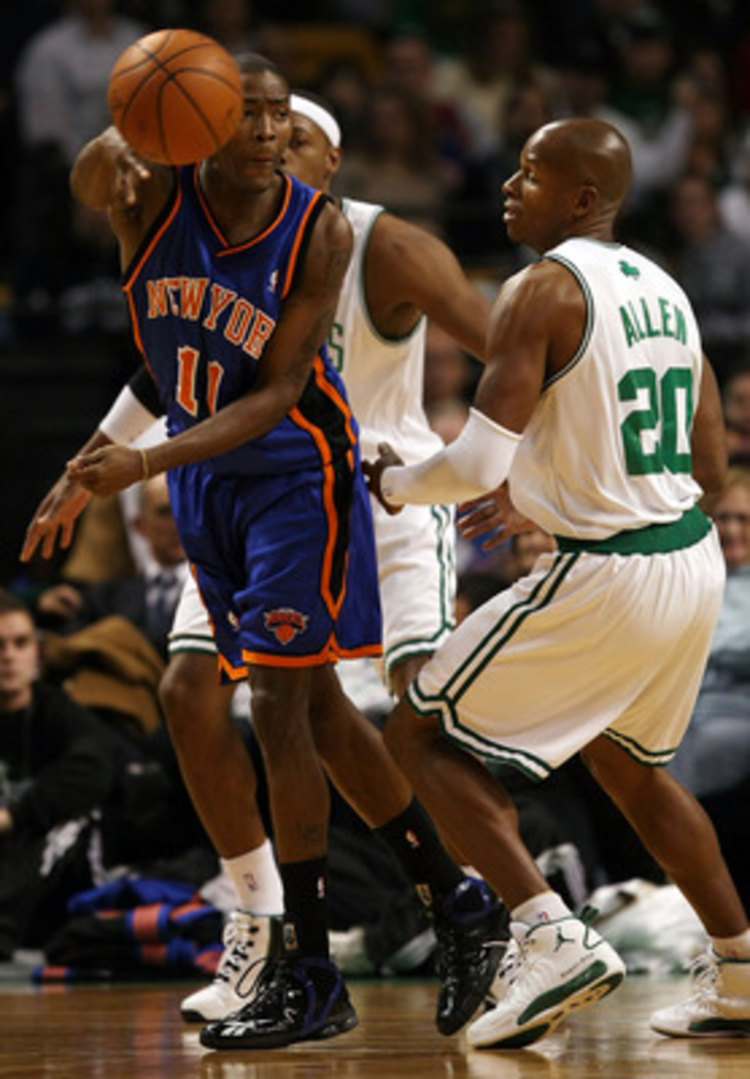 BOSTON - NOVEMBER 18:  Jamal Crawford #11 of the New York Knicks passes the ball as Ray Allen #20 of the Boston Celtics defends on November 18,  2008 at TD Banknorth Garden in Boston, Massachusetts. NOTE TO USER: User expressly acknowledges and agrees tha