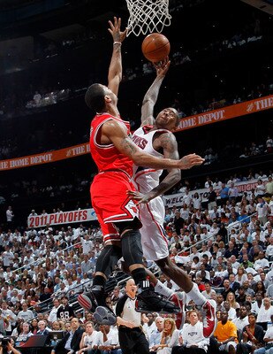 ATLANTA, GA - MAY 12: Derrick Rose #1 of the Chicago Bulls defends a dunk by Jamal Crawford #11 of the Atlanta Hawks in Game Six of the Eastern Conference Semifinals in the 2011 NBA Playoffs at Phillips Arena on May 12, 2011 in Atlanta, Georgia. NOTE TO ATLANTA, GA - MAY 12: Derrick Rose #1 of the Chicago Bulls defends a dunk by Jamal Crawford #11 of the Atlanta Hawks in Game Six of the Eastern Conference Semifinals in the 2011 NBA Playoffs at Phillips Arena on May 12, 2011 in Atlanta, Georgia. NOTE TO