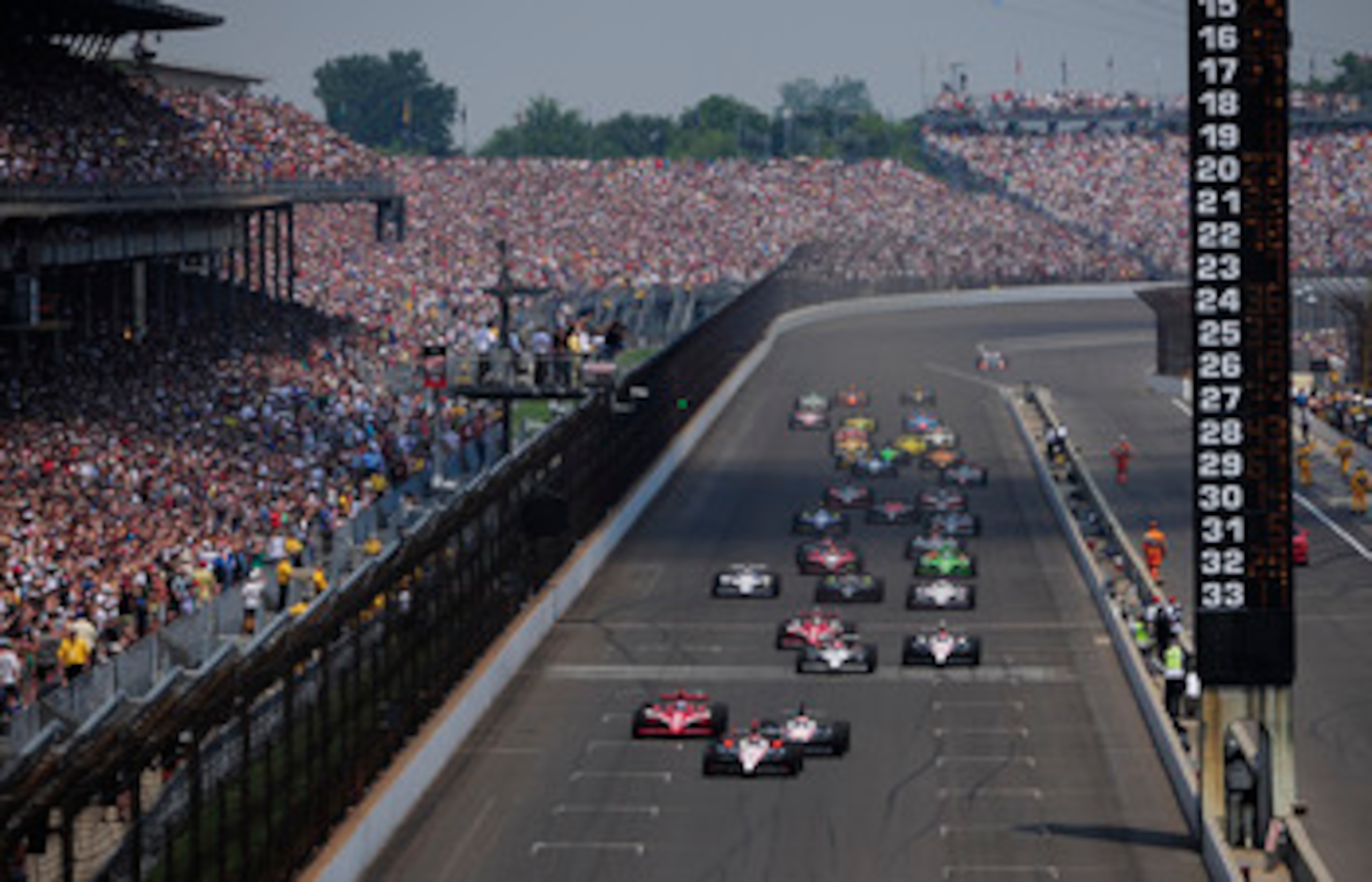 INDIANAPOLIS - MAY 30: Helio Castroneves of Brazil, driver of the #3 Team Penske Dallara Honda, leads the field at the start of the IZOD IndyCar Series 94th running of the Indianapolis 500 at the Indianapolis Motor Speedway on May 30, 2010 in Indianapoli INDIANAPOLIS - MAY 30: Helio Castroneves of Brazil, driver of the #3 Team Penske Dallara Honda, leads the field at the start of the IZOD IndyCar Series 94th running of the Indianapolis 500 at the Indianapolis Motor Speedway on May 30, 2010 in Indianapoli