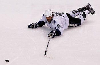 BOSTON, MA - MAY 14:  Steve Downie #9 of the Tampa Bay Lightning falls to the ice against the Boston Bruins in Game One of the Eastern Conference Finals during the 2011 NHL Stanley Cup Playoffs at TD Garden on May 14, 2011 in Boston, Massachusetts.  (Phot