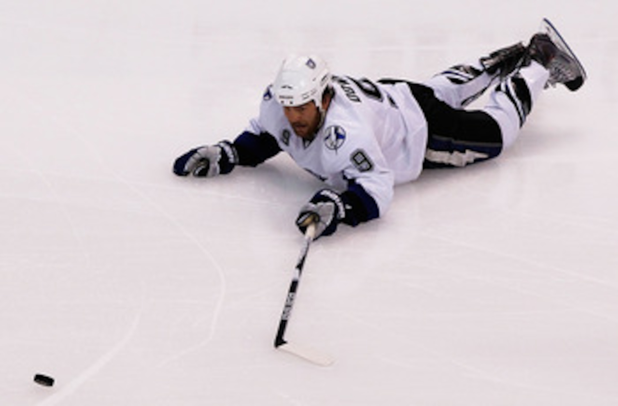BOSTON, MA - MAY 14:  Steve Downie #9 of the Tampa Bay Lightning falls to the ice against the Boston Bruins in Game One of the Eastern Conference Finals during the 2011 NHL Stanley Cup Playoffs at TD Garden on May 14, 2011 in Boston, Massachusetts.  (Phot