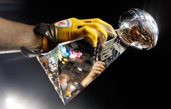 TAMPA, FL - FEBRUARY 01:  Players from the Pittsburgh Steelers celebrate with the Vince Lombardi trophy after their 27-23 win against the Arizona Cardinals during Super Bowl XLIII on February 1, 2009 at Raymond James Stadium in Tampa, Florida.  (Photo by 