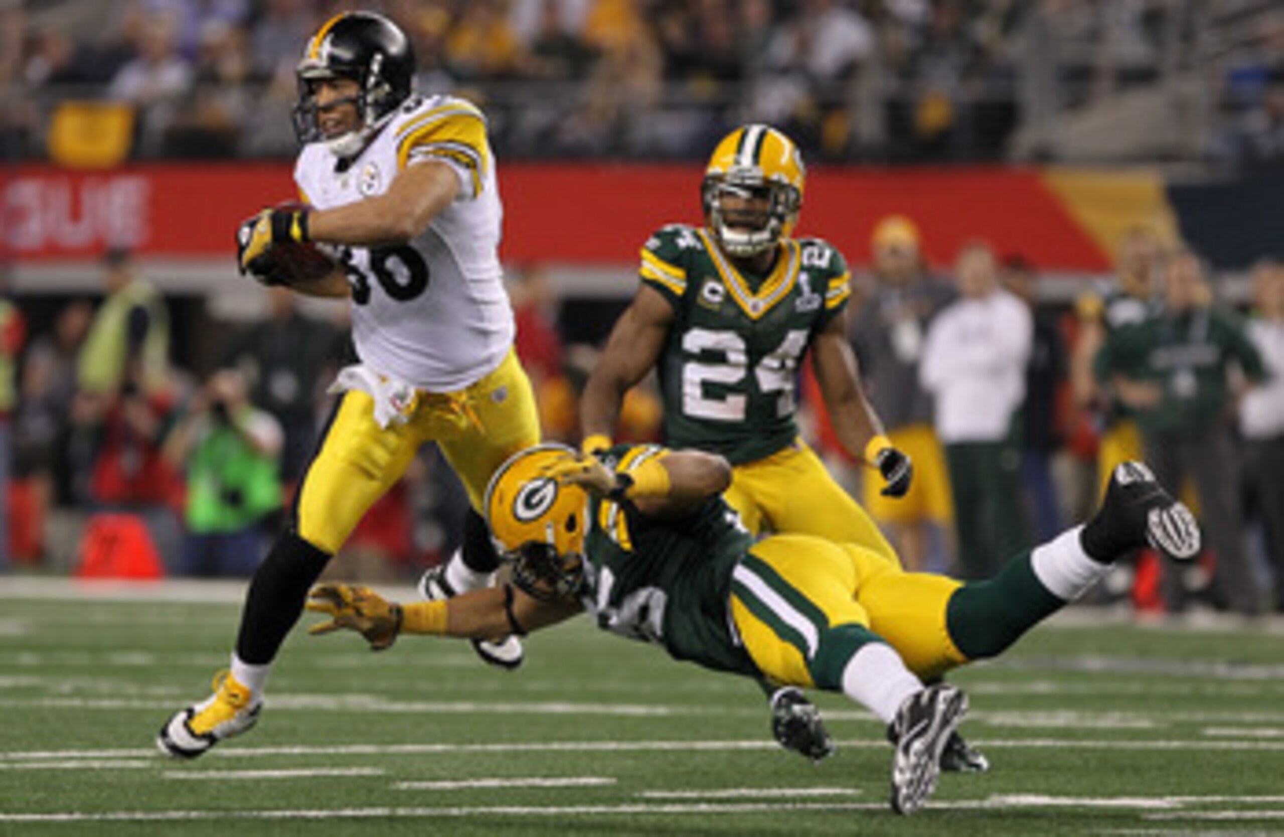 ARLINGTON, TX - FEBRUARY 06:  Hines Ward #86 of the Pittsburgh Steelers tries to avoid the tackle of Desmond Bishop #55 of the Green Bay Packers during Super Bowl XLV at Cowboys Stadium on February 6, 2011 in Arlington, Texas.  (Photo by Doug Pensinger/Ge
