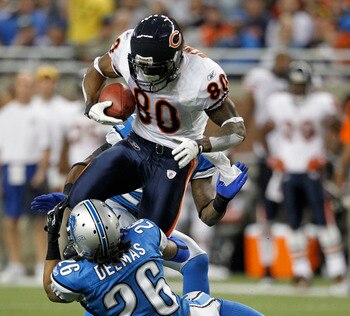 DETROIT - DECEMBER 05: Earl Bennett #80 of the Chicago Bears catches a 12 yard pass for a first down as Louis Delmas #26 of the Detroit Lions makes the stop during the game at Ford Field on December 5, 2010 in Detroit, Michigan. The Bears defeated the Lio