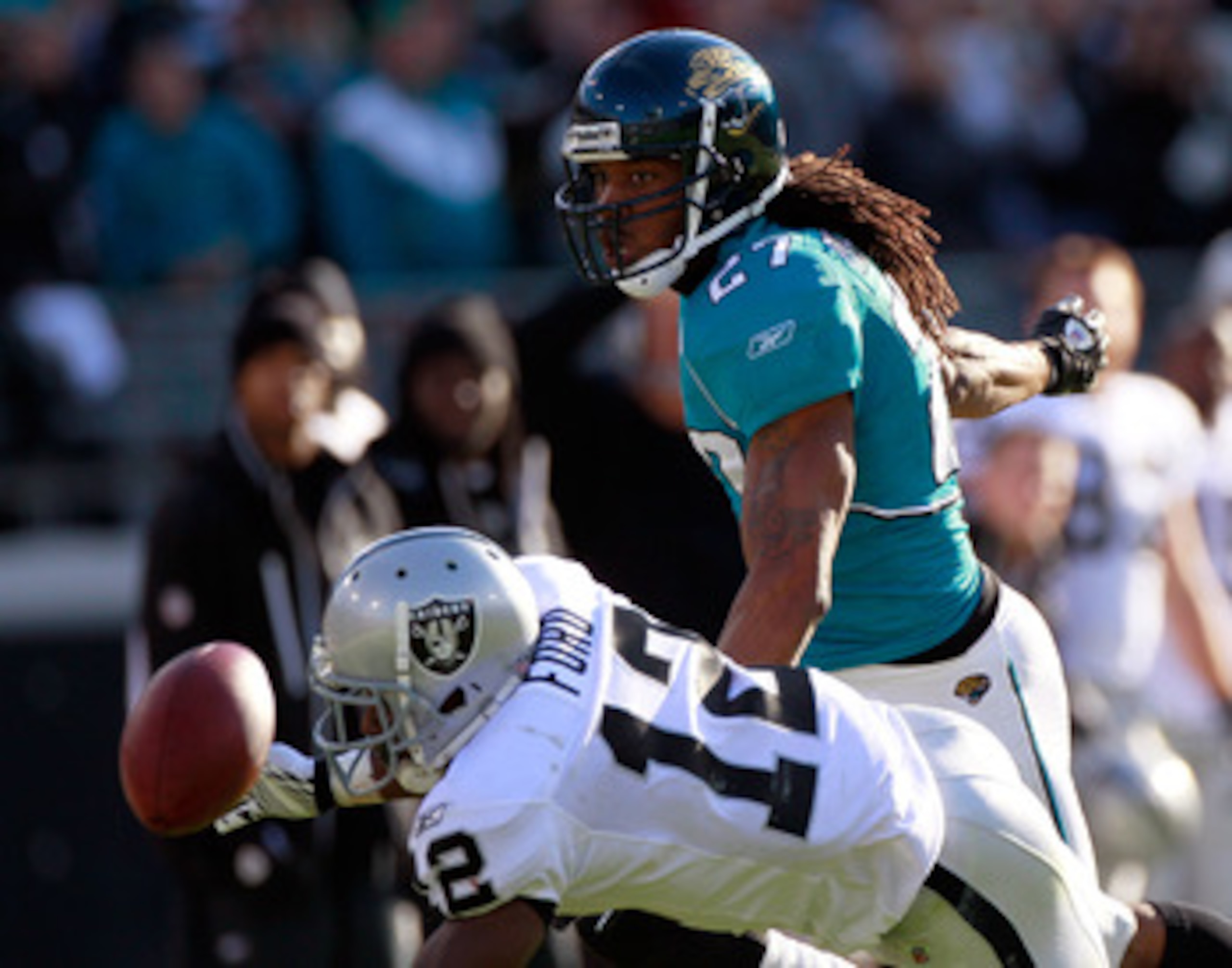 JACKSONVILLE, FL - DECEMBER 12:  Rashean Mathis #27 of the Jacksonville Jaguars defends a pass against Jacoby Ford #12 of the Oakland Raiders during the game at EverBank Field on December 12, 2010 in Jacksonville, Florida.  (Photo by Sam Greenwood/Getty I