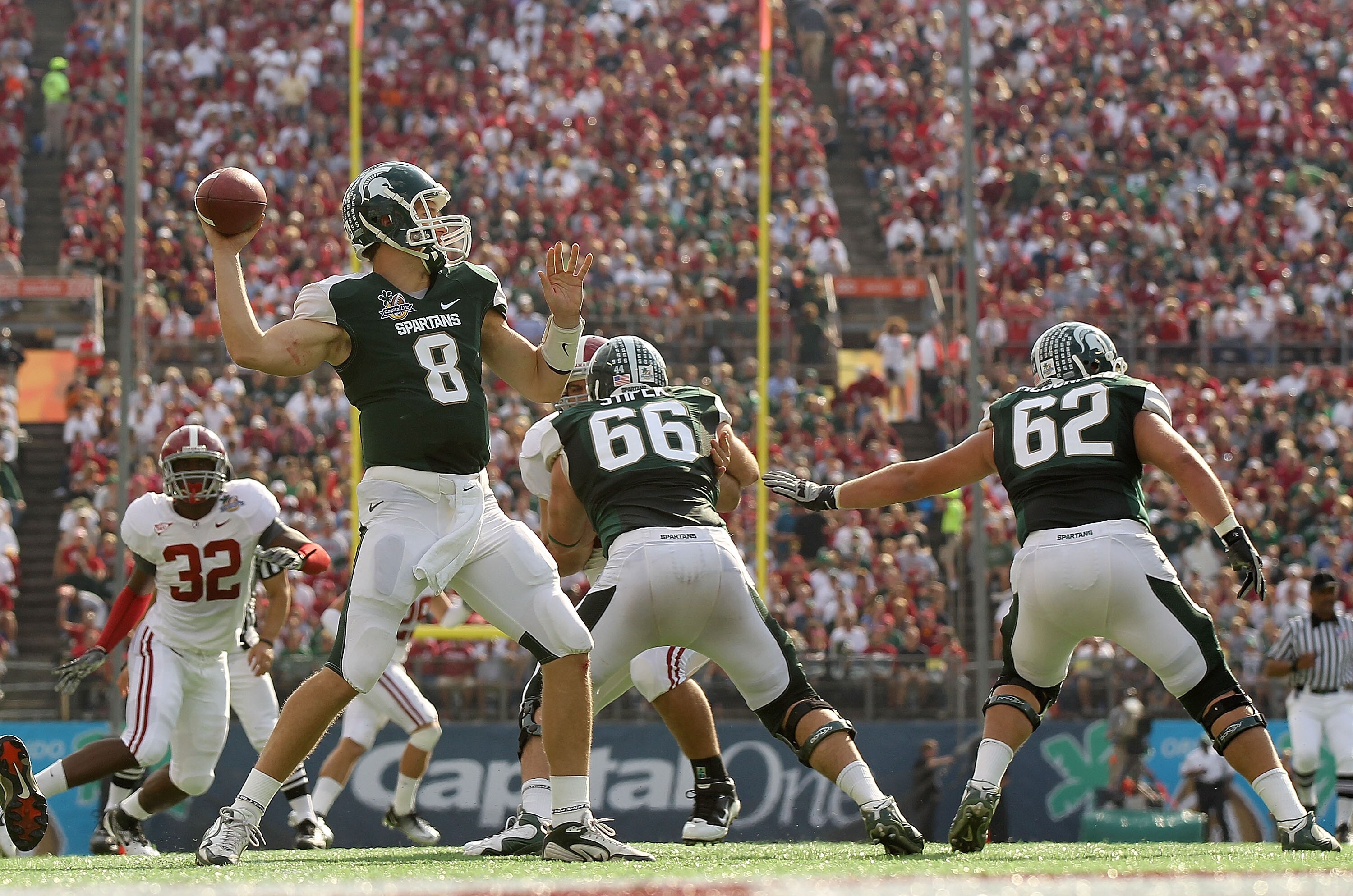 ORLANDO, FL - JANUARY 01: Kirk Cousins #8 of the Michigan State Spartans passes the ball during the Capitol One Bowl against the Alabama Crimson Tide at the Florida Citrus Bowl on January 1, 2011 in Orlando, Florida. (Photo by Mike Ehrmann/Getty Images) ORLANDO, FL - JANUARY 01: Kirk Cousins #8 of the Michigan State Spartans passes the ball during the Capitol One Bowl against the Alabama Crimson Tide at the Florida Citrus Bowl on January 1, 2011 in Orlando, Florida. (Photo by Mike Ehrmann/Getty Images)