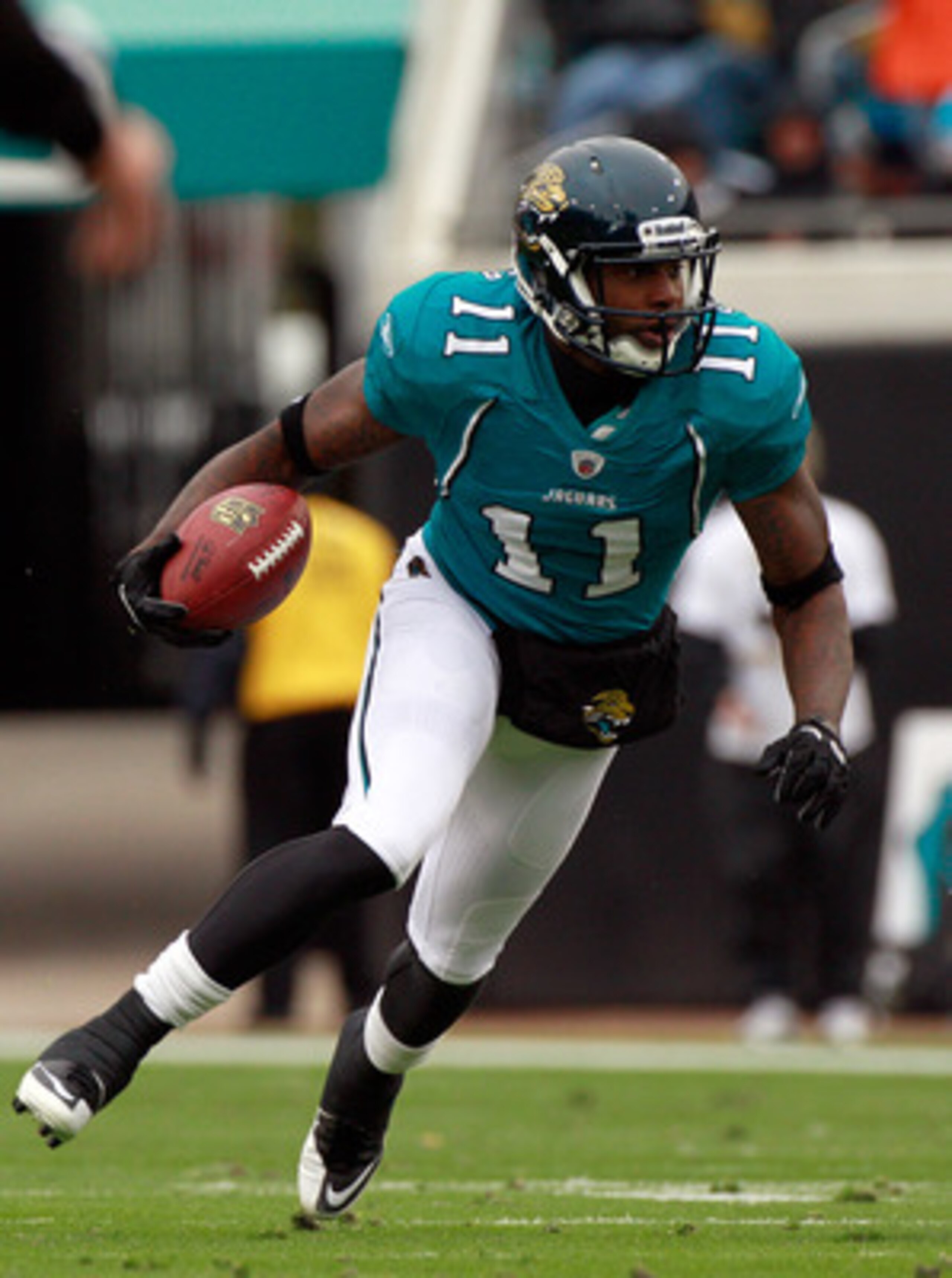 JACKSONVILLE, FL - DECEMBER 26:  Mike Sims-Walker #11 of the Jacksonville Jaguars runs for yardage during the game against the Washington Redskins at EverBank Field on December 26, 2010 in Jacksonville, Florida.  (Photo by Sam Greenwood/Getty Images)