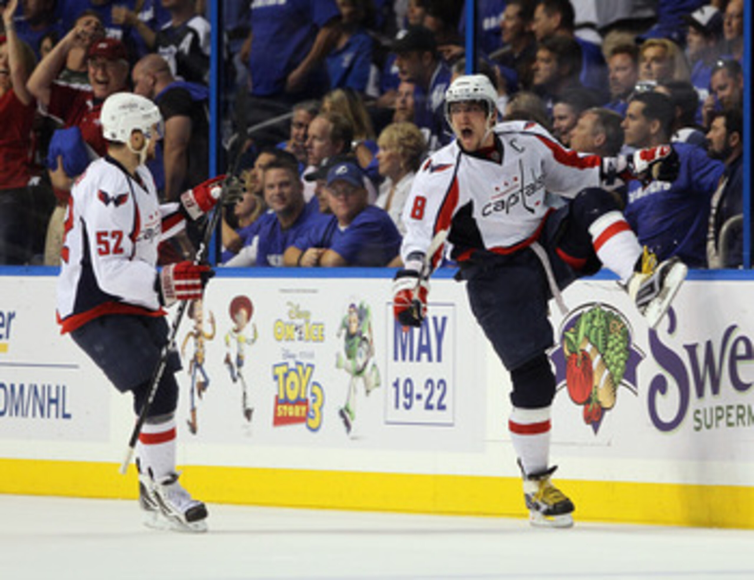 TAMPA, FL - MAY 03: Alex Ovechkin #8 of the Washington Capitals scores a power play goal at 17:27 of the second period against the Tampa Bay Lightning and is joined by Mike Green #52 in Game Three of the Eastern Conference Semifinals during the 2011 NHL S