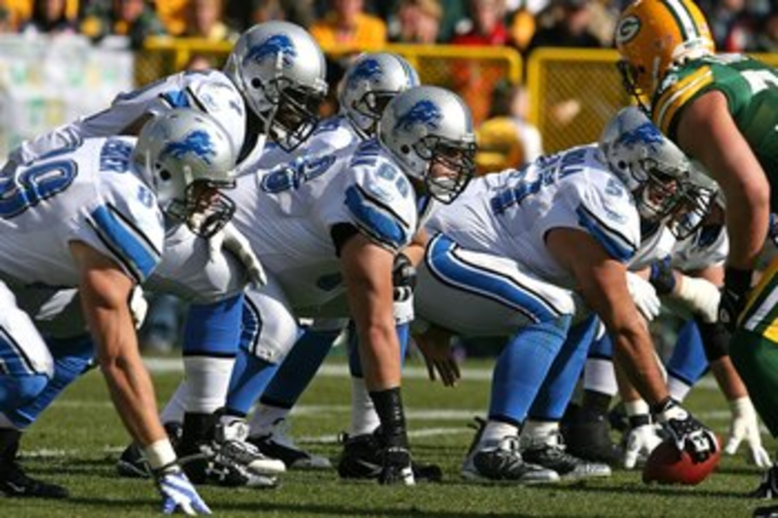 GREEN BAY, WI - OCTOBER 18: Members of the Detroit Lion offensive line including Stephen Peterman #66 and Dominic Raiola #51 prepare for the start of play against the Green Bay Packers at Lambeau Field on October 18, 2009 in Green Bay, Wisconsin. The Pack
