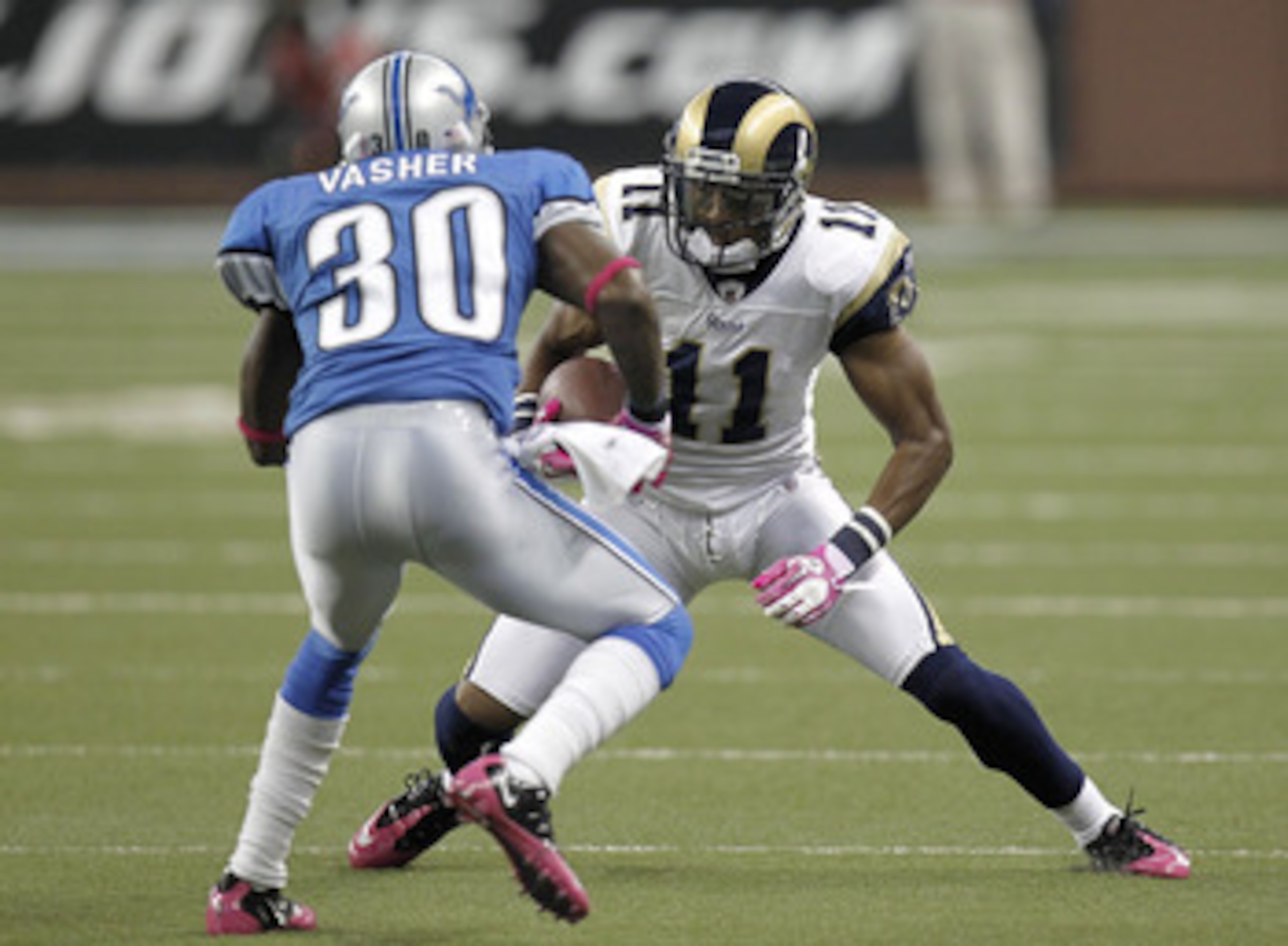 DETROIT - OCTOBER 10: Brandon Gibson #11 of the St. Louis Rams tries to get around the tackle of Nathan Vasher #30 of the Detroit Lions on October 10, 2010 at Ford Field in Detroit, Michigan.  (Photo by Gregory Shamus/Getty Images)