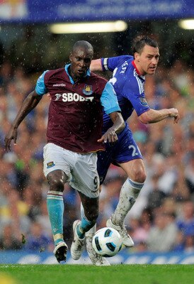 LONDON, ENGLAND - APRIL 23:  Carlton Cole of West Ham holds off the challenge from John Terry of Chelsea during the Barclays Premier League match between Chelsea and West Ham United at Stamford Bridge on April 23, 2011 in London, England.  (Photo by Jamie