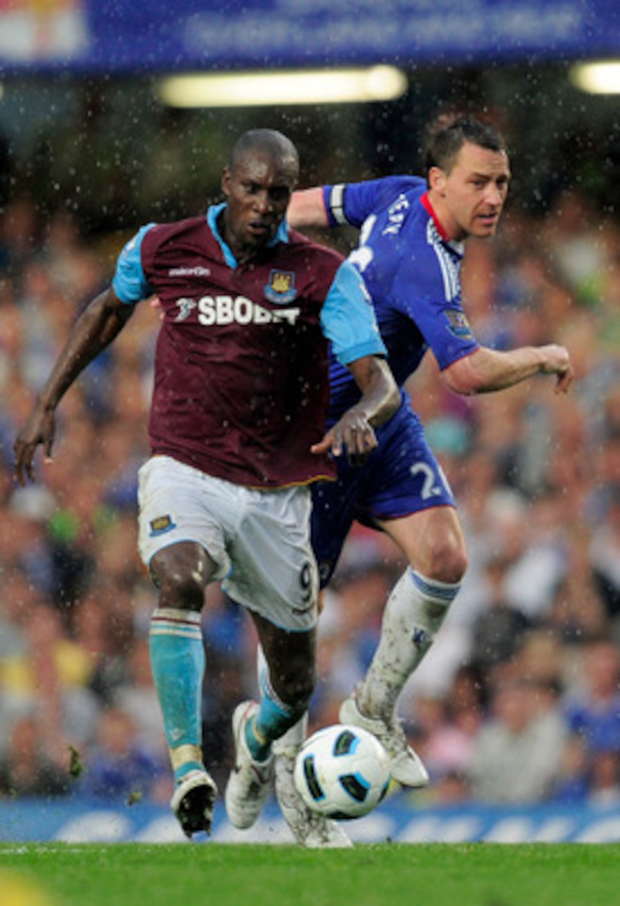 LONDON, ENGLAND - APRIL 23: Carlton Cole of West Ham holds off the challenge from John Terry of Chelsea during the Barclays Premier League match between Chelsea and West Ham United at Stamford Bridge on April 23, 2011 in London, England. (Photo by Jamie LONDON, ENGLAND - APRIL 23: Carlton Cole of West Ham holds off the challenge from John Terry of Chelsea during the Barclays Premier League match between Chelsea and West Ham United at Stamford Bridge on April 23, 2011 in London, England. (Photo by Jamie