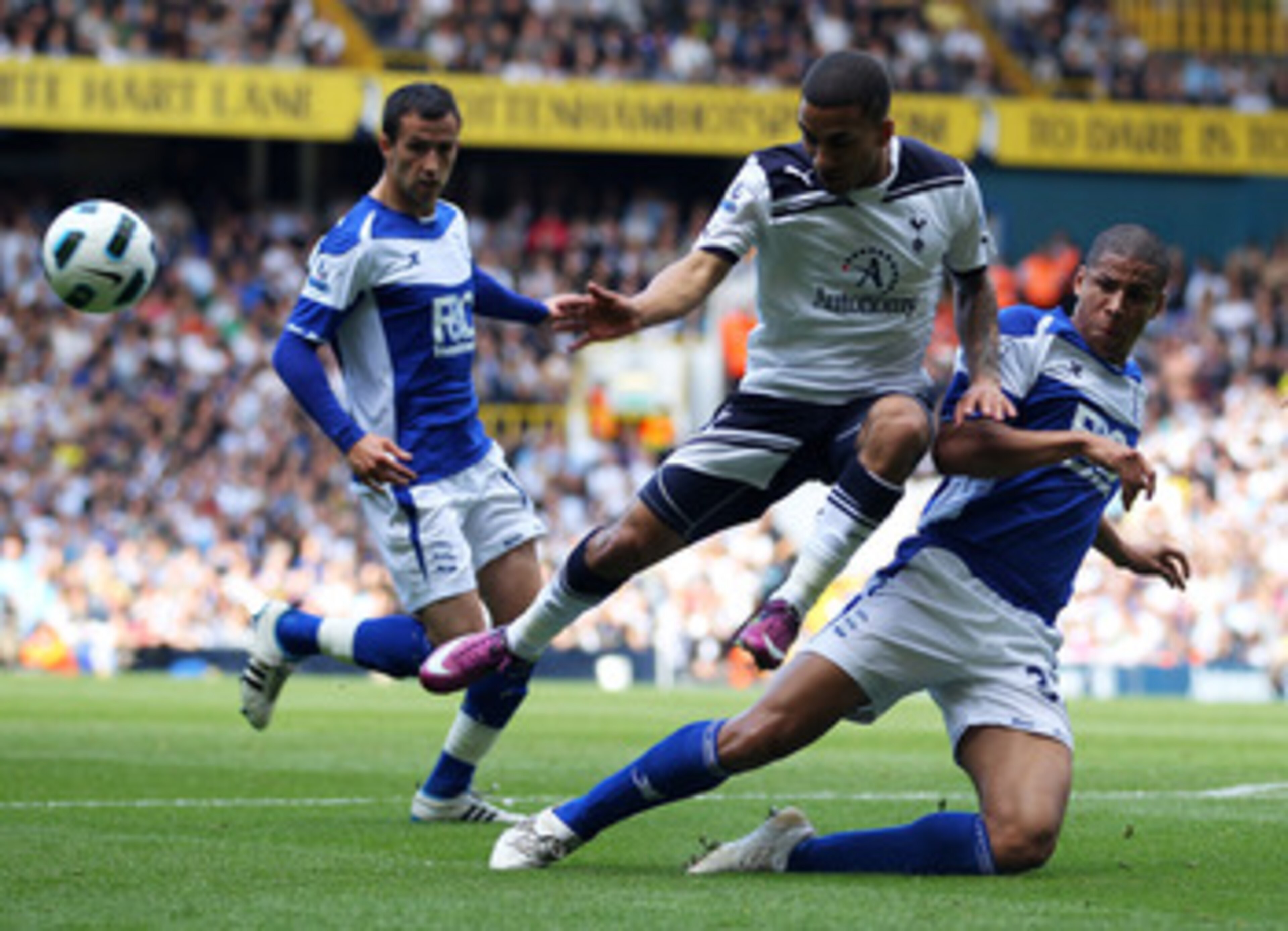 LONDON, ENGLAND - MAY 22:  Aaron Lennon of Tottenham Hotspur is challenged by Curtis Davies of Birmingham City during the Barclays Premier League match between Tottenham Hotspur and Birmingham City at White Hart Lane on May 22, 2011 in London, England.  (