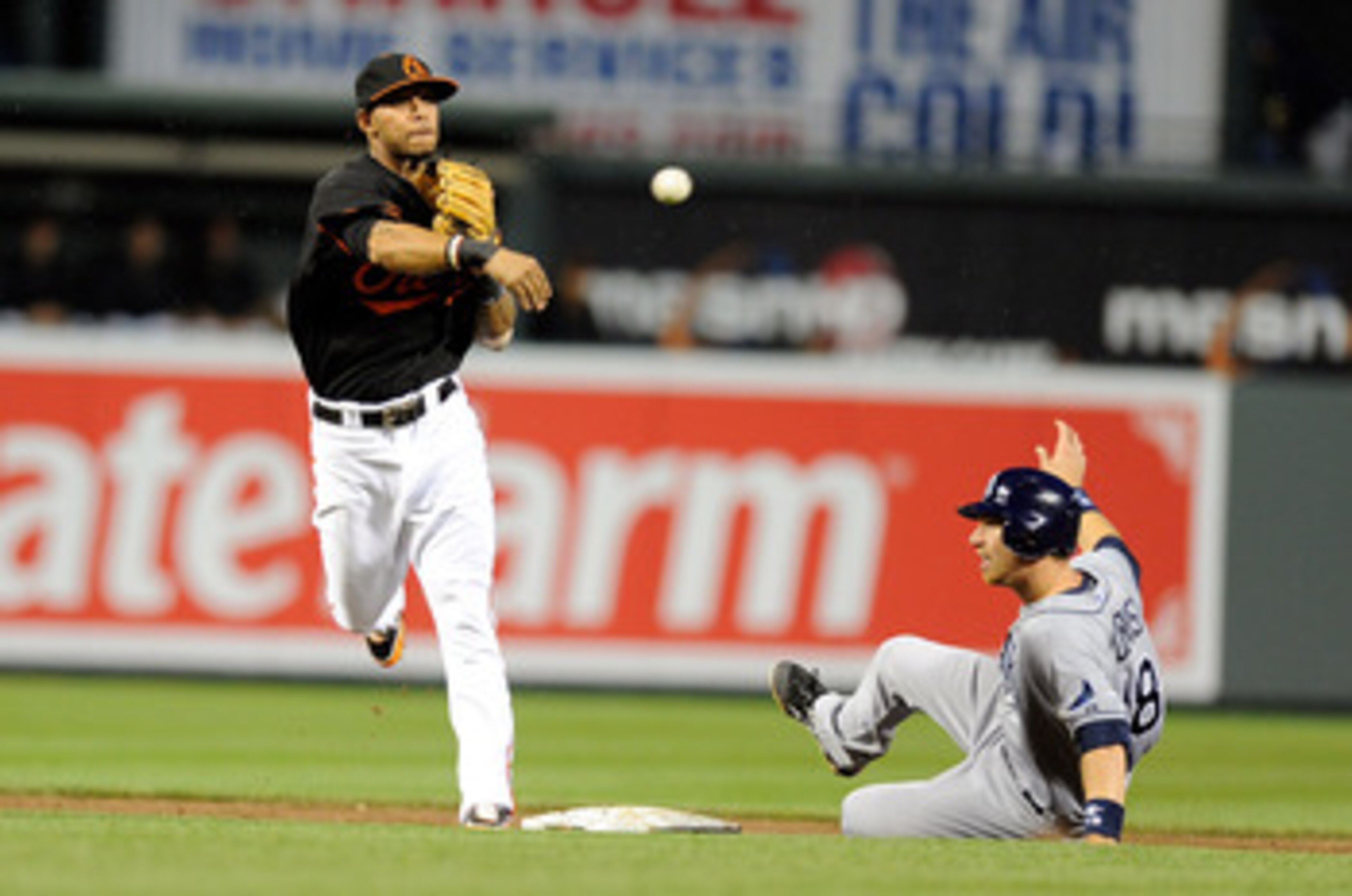BALTIMORE, MD - MAY 06:  Ben Zobrist #18 of the Tampa Bay Rays is forced out at second base by Robert Andino #11 of the Baltimore Orioles at Oriole Park at Camden Yards on May 6, 2011 in Baltimore, Maryland.  (Photo by Greg Fiume/Getty Images)