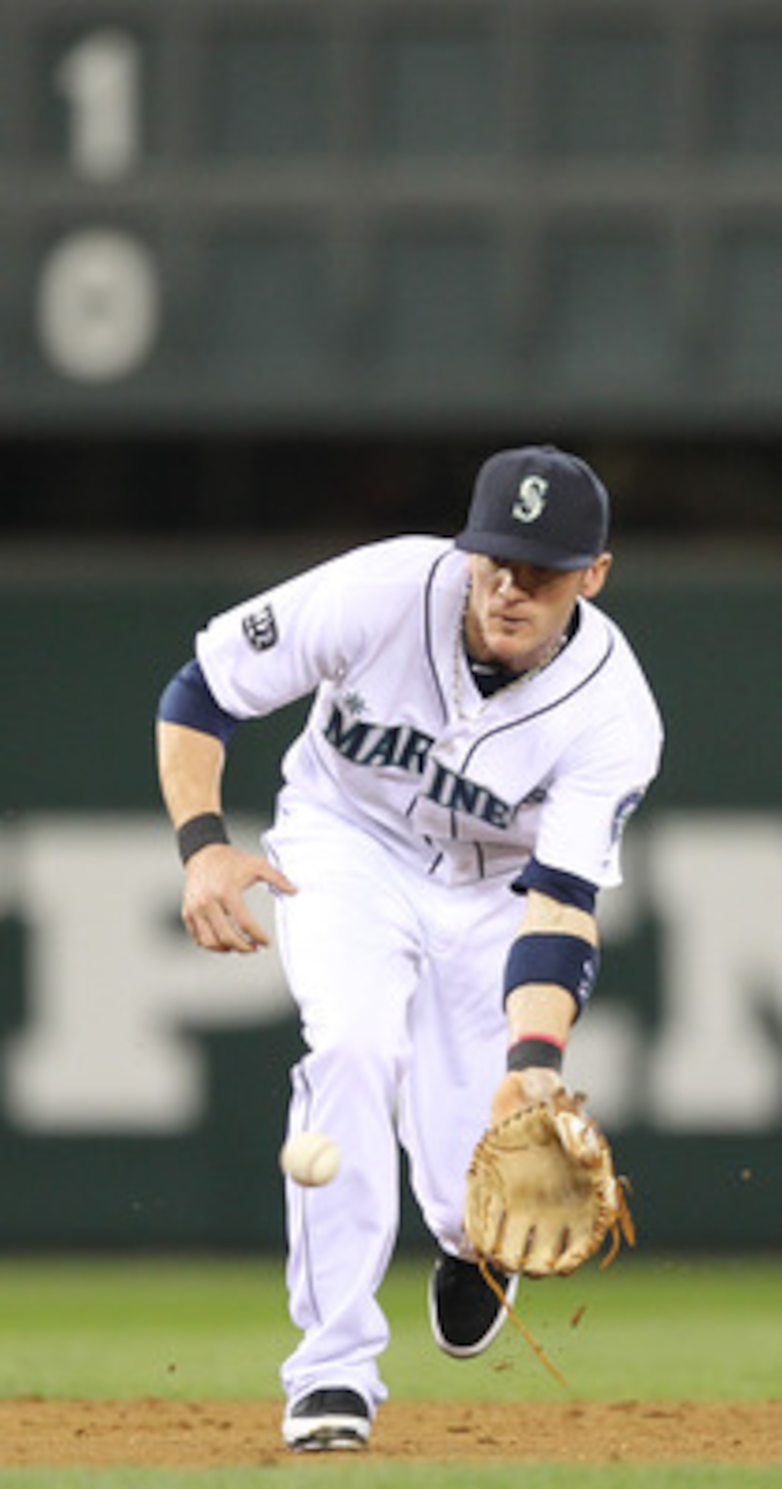 SEATTLE - MAY 04:  Shortstop Brendan Ryan #26 of the Seattle Mariners fields a grounder against the Texas Rangers at Safeco Field on May 4, 2011 in Seattle, Washington. (Photo by Otto Greule Jr/Getty Images)