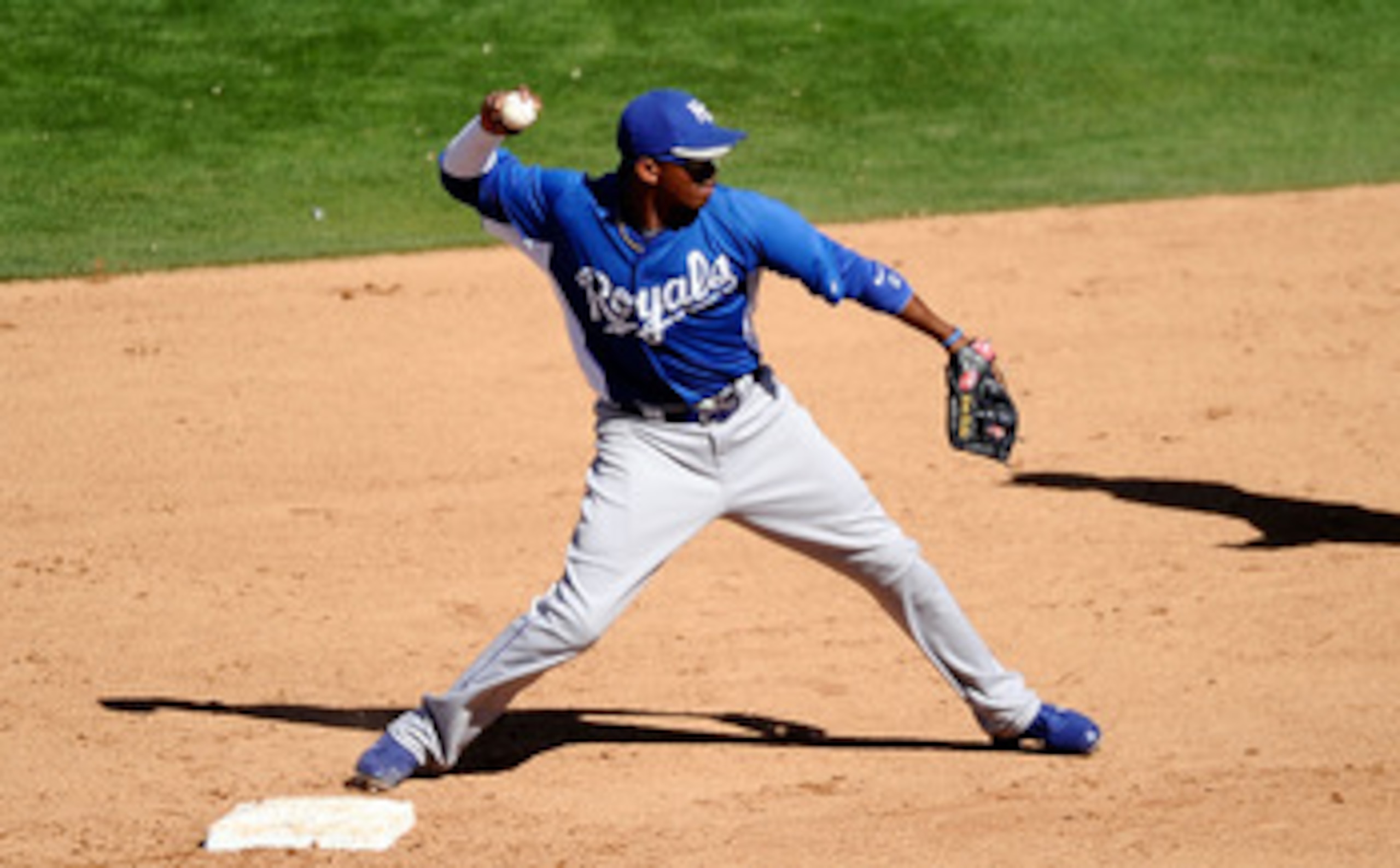 MESA, AZ - MARCH 09:  Alcides Escobar #2 of the Kansas City Royals throws to first base against the Chicago Cubs during the spring training baseball game at HoHoKam Stadium on March 9, 2011 in Mesa, Arizona.  (Photo by Kevork Djansezian/Getty Images)