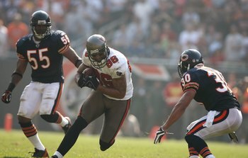 CHICAGO - SEPTEMBER 21:  Jerramy Stevens #86 of the Tampa Bay Buccaneers runs with the ball against Mike Brown #30 of the Chicago Bears at Soldier Field on September 21, 2008 in Chicago, Illinois. The Buccaneers won 27-24 in OT. (Photo by Jonathan Ferrey/