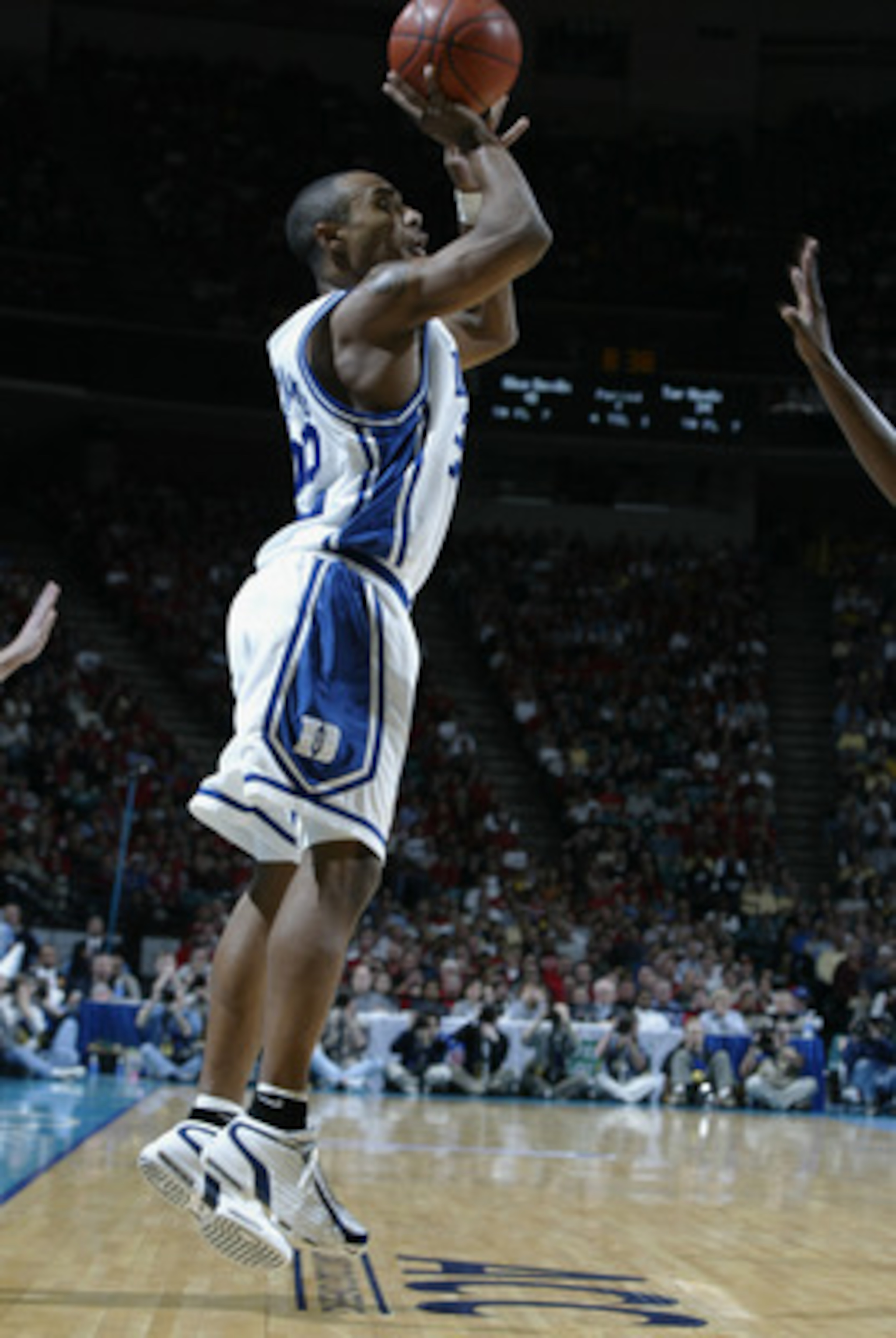 08 Mar 2002:  Jason Williams #22 of Duke shoots over the defense of North Carolina during the ACC Tournament game at the Charlotte Coliseum in Charlotte, North Carolina. Duke won 60-48. DIGITAL IMAGE Mandatory Credit: Craig Jones/Getty Images