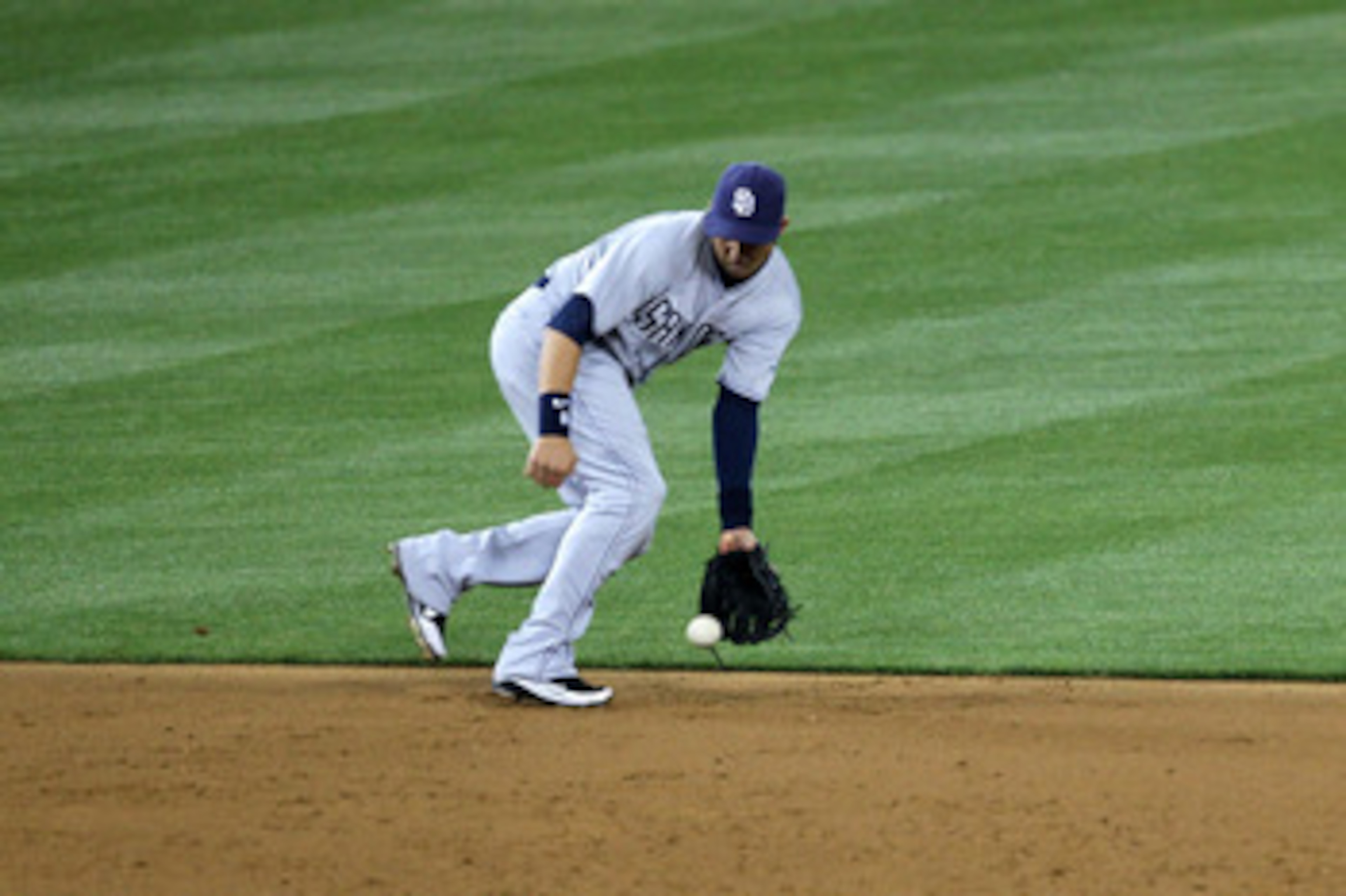LOS ANGELES - APRIL 29:  Shortstop Jason Bartlett #8 of the San Diego Padres fields a ground ball hit by Matt Kemp of the Los Angeles Dodgers in the fourth inning on April 29, 2011 at Dodger Stadium in Los Angeles, California.  (Photo by Stephen Dunn/Gett