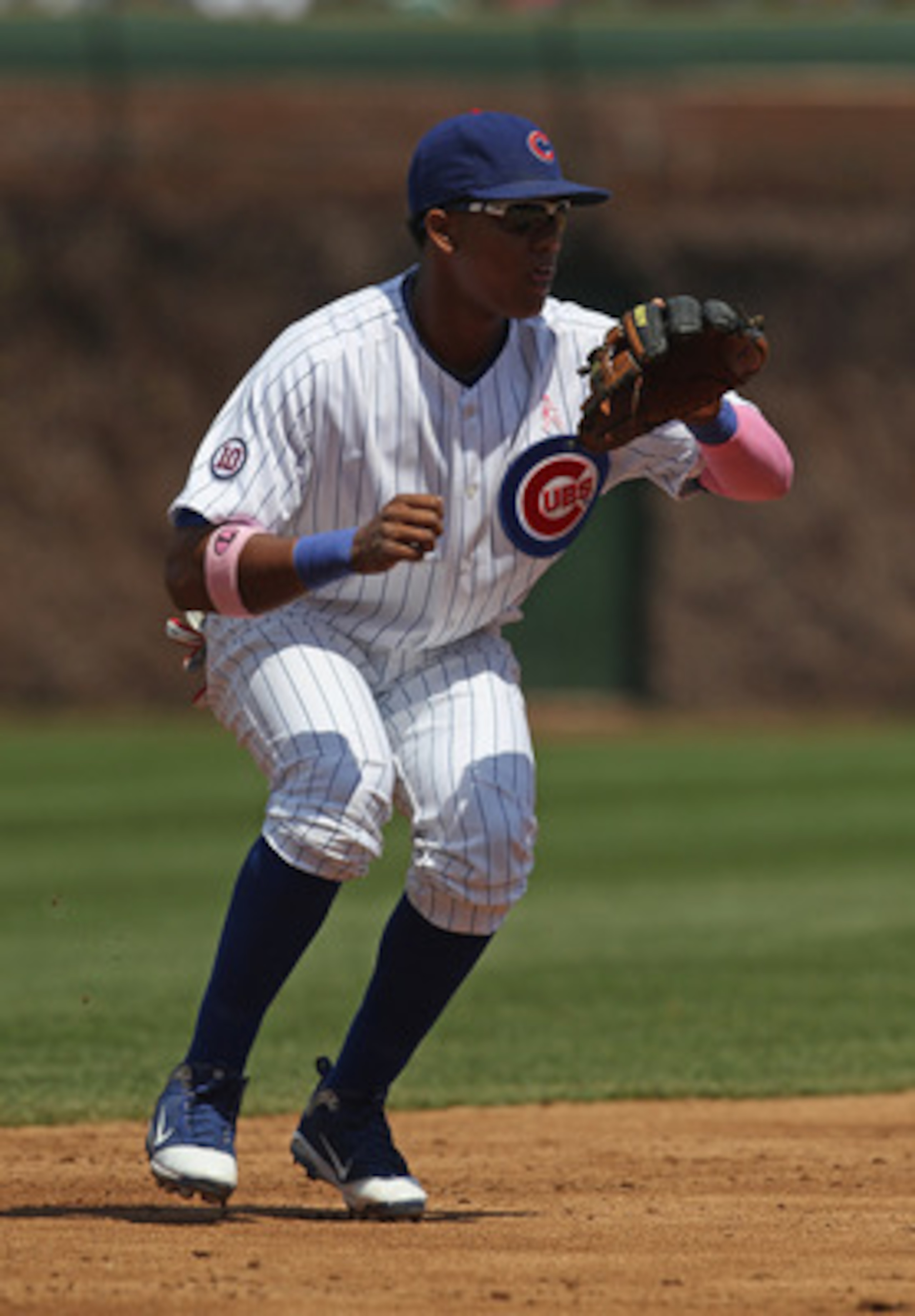 CHICAGO, IL - MAY 08: Starlin Castro #13 of the Chicago Cubs fields the ball against the Cincinnati Reds at Wrigley Field on May 8, 2011 in Chicago, Illinois. The Reds defeated the Cubs 2-0. (Photo by Jonathan Daniel/Getty Images)