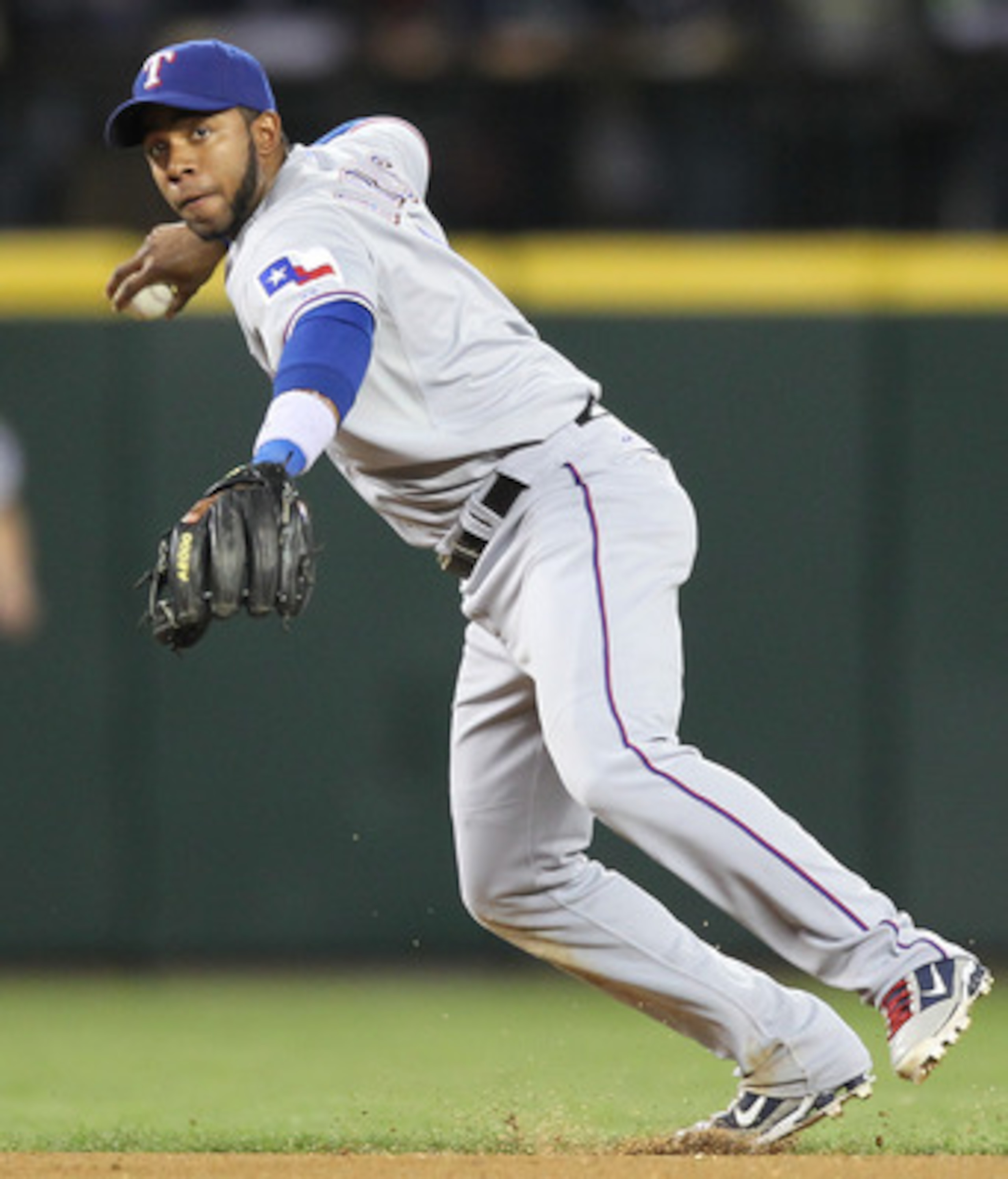 SEATTLE - MAY 04:  Shortstop Elvis Andrus #1 of the Texas Rangers throws to first on a ground out against the Seattle Mariners at Safeco Field on May 4, 2011 in Seattle, Washington. (Photo by Otto Greule Jr/Getty Images)