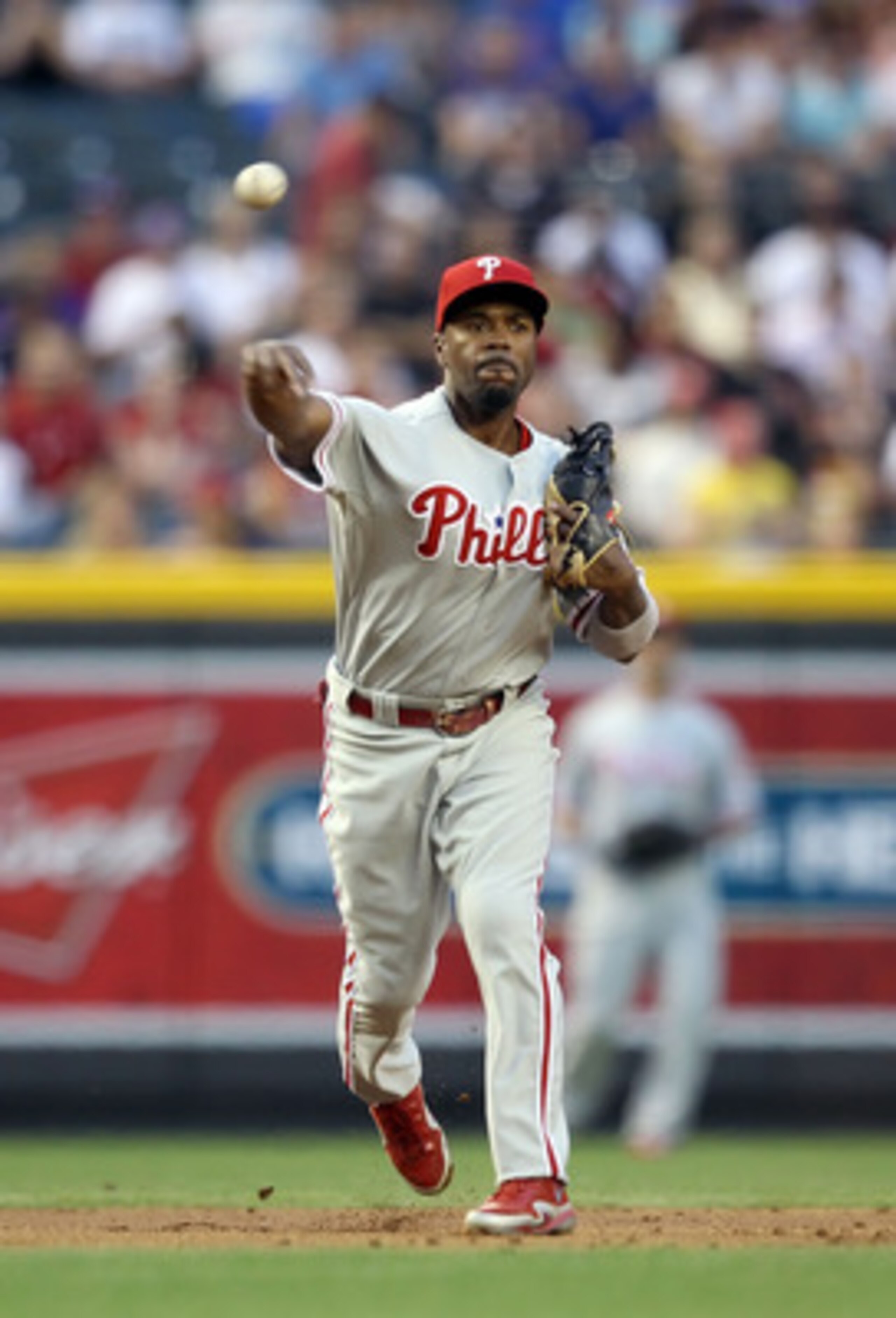 PHOENIX, AZ - APRIL 26:  Infielder Jimmy Rollins #11 of the Philadelphia Phillies fields a ground ball out agaisnt the Arizona Diamondbacks during the Major League Baseball game at Chase Field on April 26, 2011 in Phoenix, Arizona. The Diamondbacks defeat