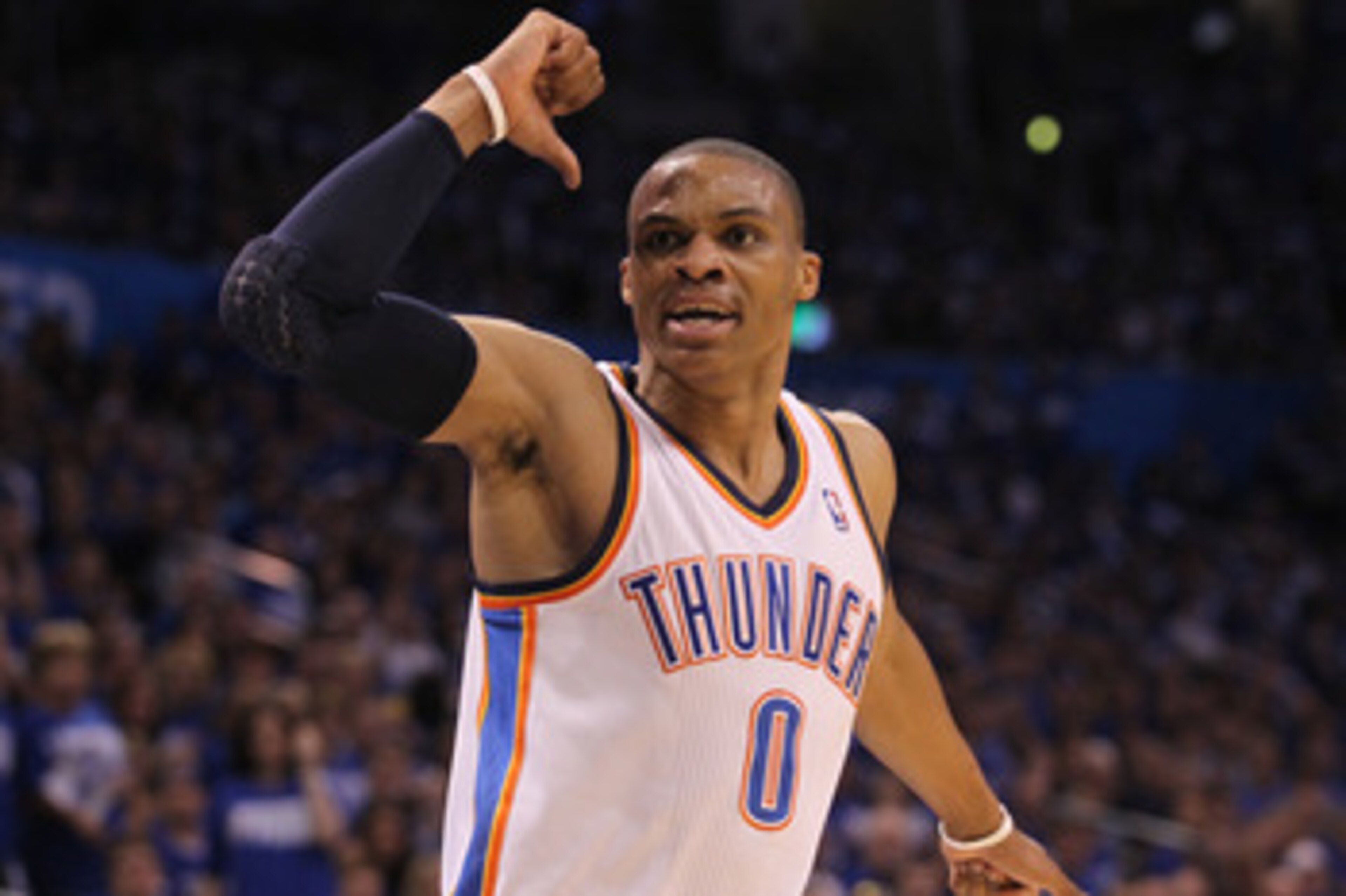 OKLAHOMA CITY, OK - MAY 21:  (C) Russell Westbrook #0 of the Oklahoma City Thunder looks on in the second half while taking on the Dallas Mavericks in Game Three of the Western Conference Finals during the 2011 NBA Playoffs at Oklahoma City Arena on May 2