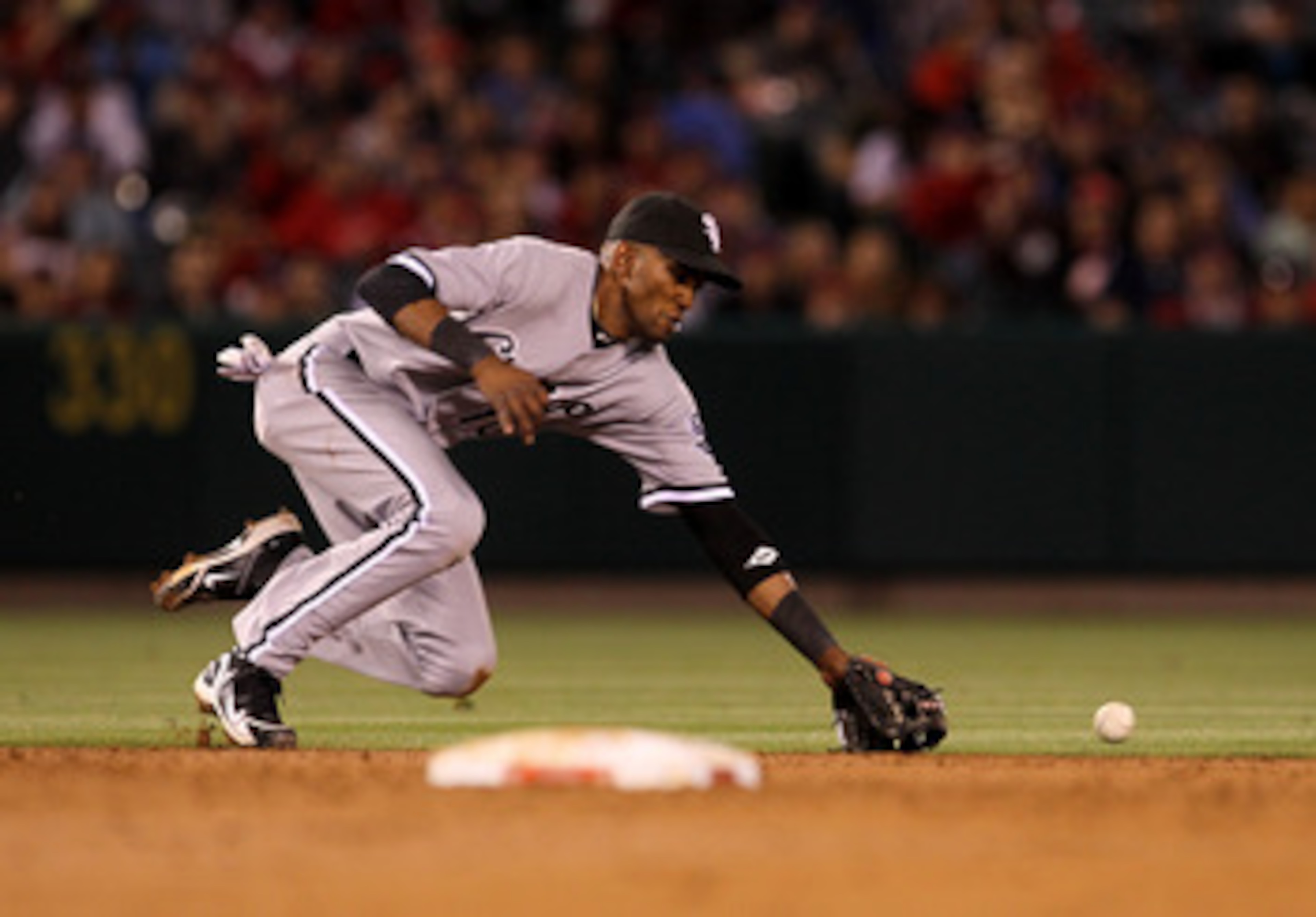 ANAHEIM, CA - MAY 11: Shortstop Alexei Ramirez #10 of the Chicago White Sox can't reach an RBI single hit by Torii Hunter #48 of the Los Angeles Angels of Anaheim on May 11, 2011 at Angel Stadium in Anaheim, California.   (Photo by Stephen Dunn/Getty Imag