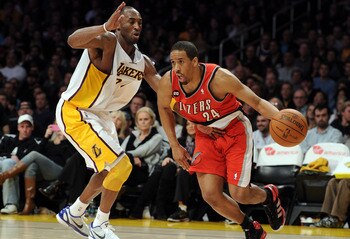 LOS ANGELES, CA - MARCH 20:  Andre Miller #24 of the Portland Trail Blazers dribbles around Kobe Bryant #24 of the Los Angeles Lakers at the Staples Center on March 20, 2011 in Los Angeles, California.  NOTE TO USER: User expressly acknowledges and agrees