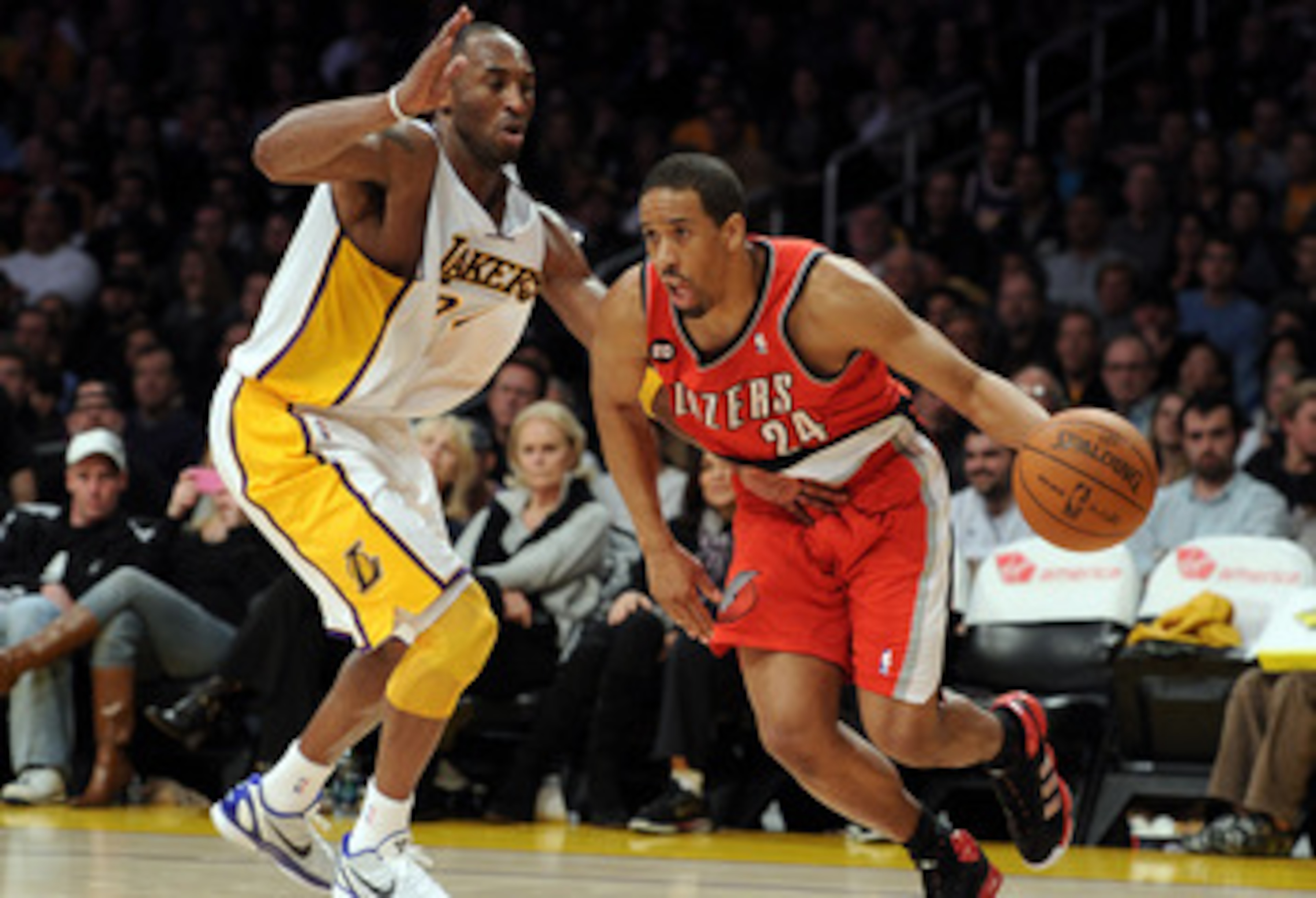 LOS ANGELES, CA - MARCH 20:  Andre Miller #24 of the Portland Trail Blazers dribbles around Kobe Bryant #24 of the Los Angeles Lakers at the Staples Center on March 20, 2011 in Los Angeles, California.  NOTE TO USER: User expressly acknowledges and agrees