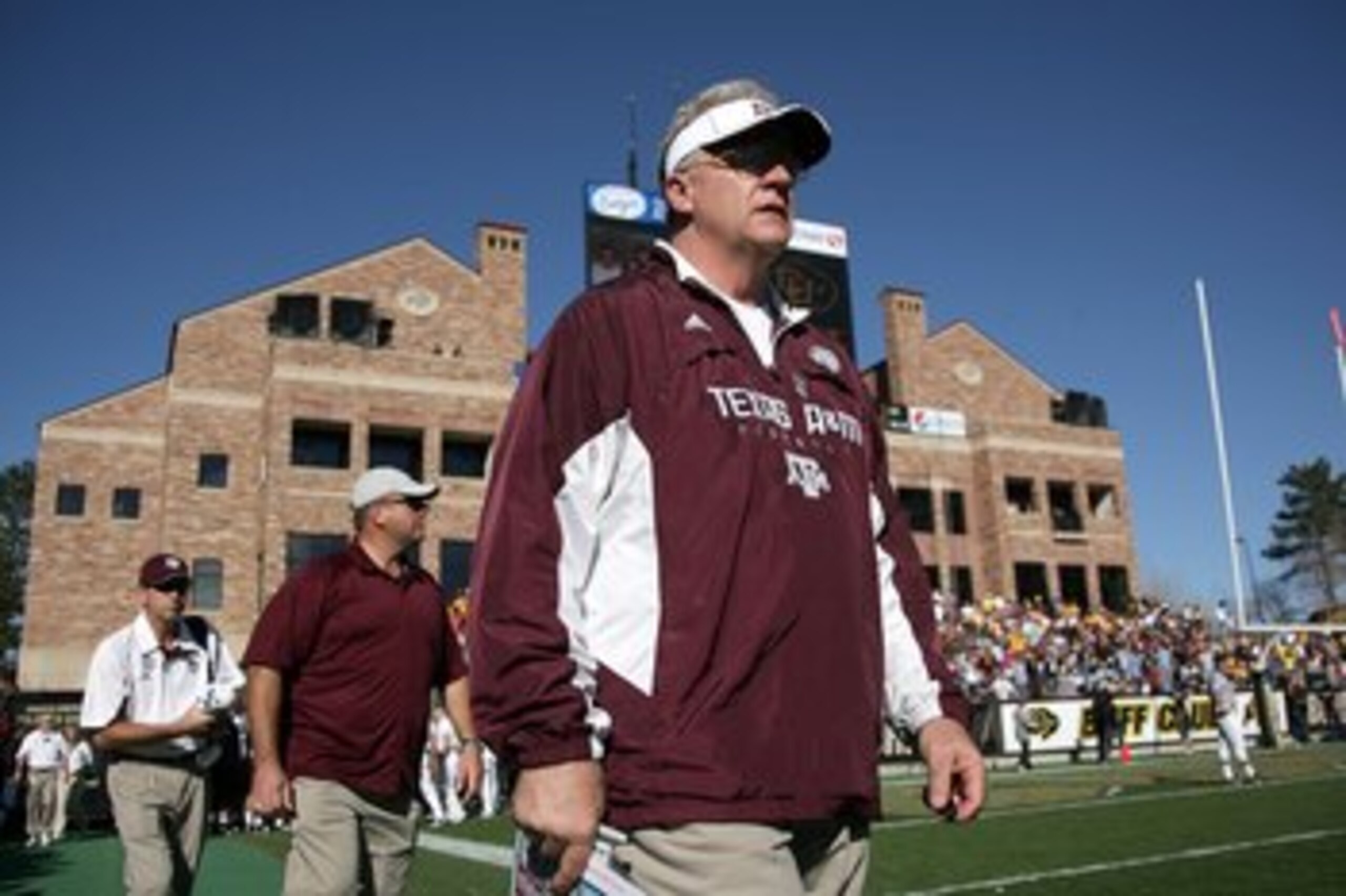 BOULDER, CO - NOVEMBER 07:  Head coach Mike Sherman of the Texas A&M Aggies enters the field for the second half as he leads his team against the Colorado Buffaloes during NCAA college football action at Folsom Field on November 7, 2009 in Boulder, Colora