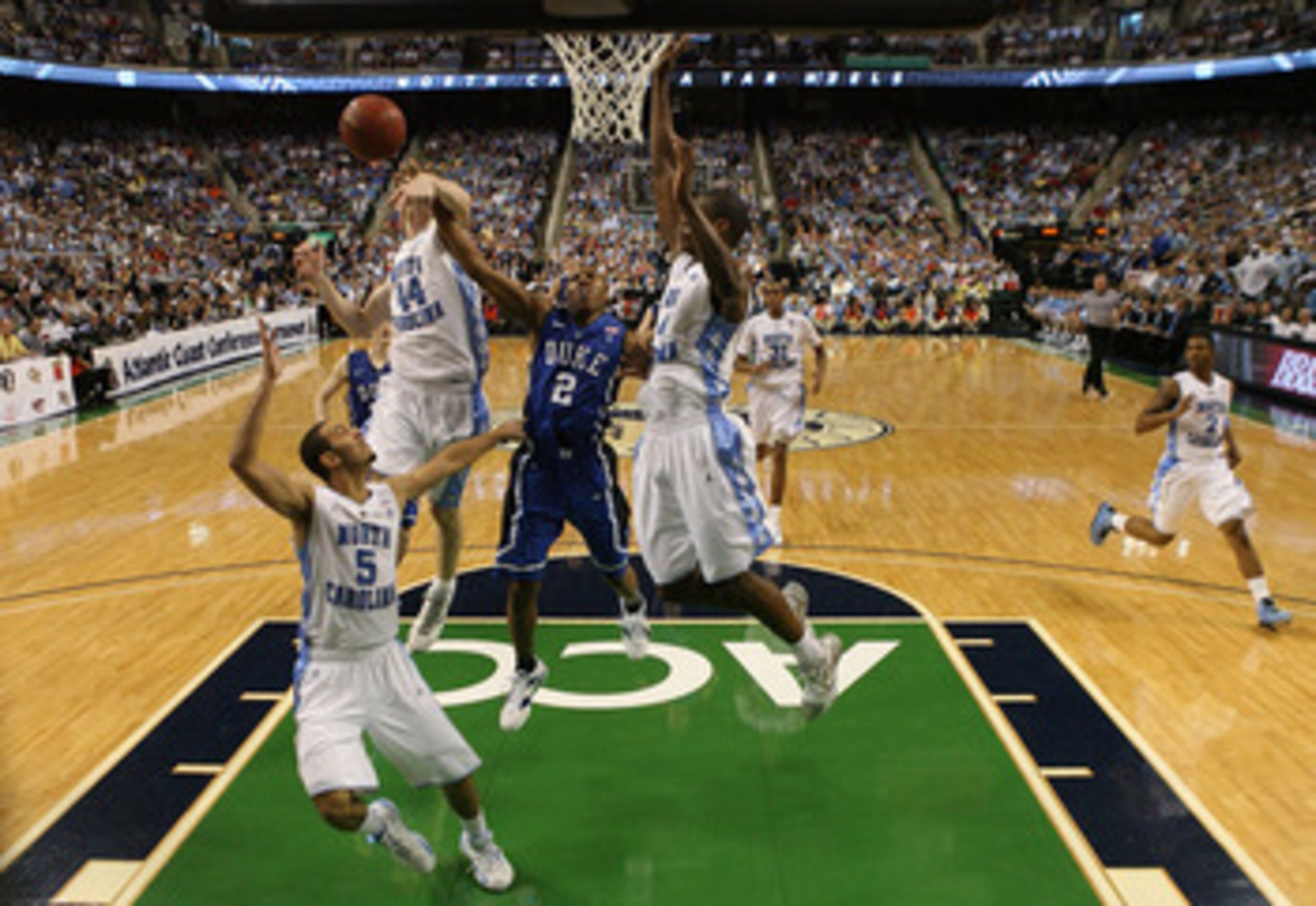 GREENSBORO, NC - MARCH 13:  Nolan Smith #2 of the Duke Blue Devils battles against Tyler Zeller #44, Kendall Marshall #5 and Harrison Barnes #40 of the North Carolina Tar Heels during the second half in the championship game of the 2011 ACC men's basketba
