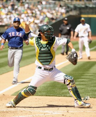 OAKLAND, CA - APRIL 30:  Kurt Suzuki #8 of the Oakland Athletics in action against the Texas Rangers at Oakland-Alameda County Coliseum on April 30, 2011 in Oakland, California.  (Photo by Ezra Shaw/Getty Images)