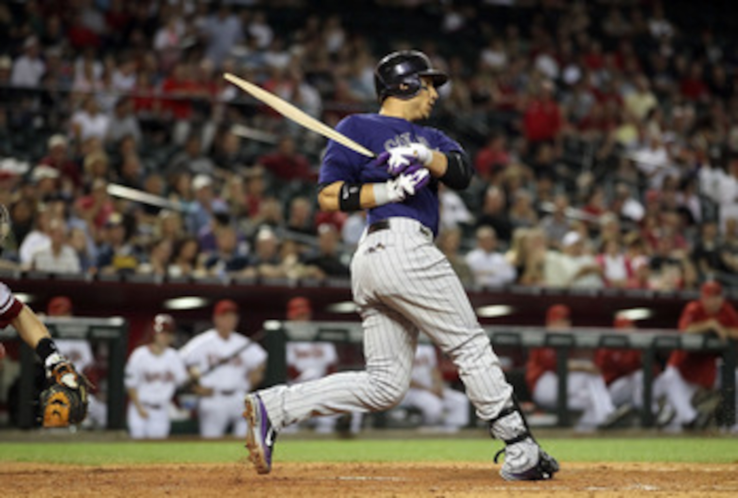 PHOENIX, AZ - MAY 05:  Carlos Gonzalez #5 of the Colorado Rockies bats against the Arizona Diamondbacks during the Major League Baseball game at Chase Field on May 5, 2011 in Phoenix, Arizona.  The Diamondbacks defeated the Rockies 3-2 in 11 innings.  (Ph