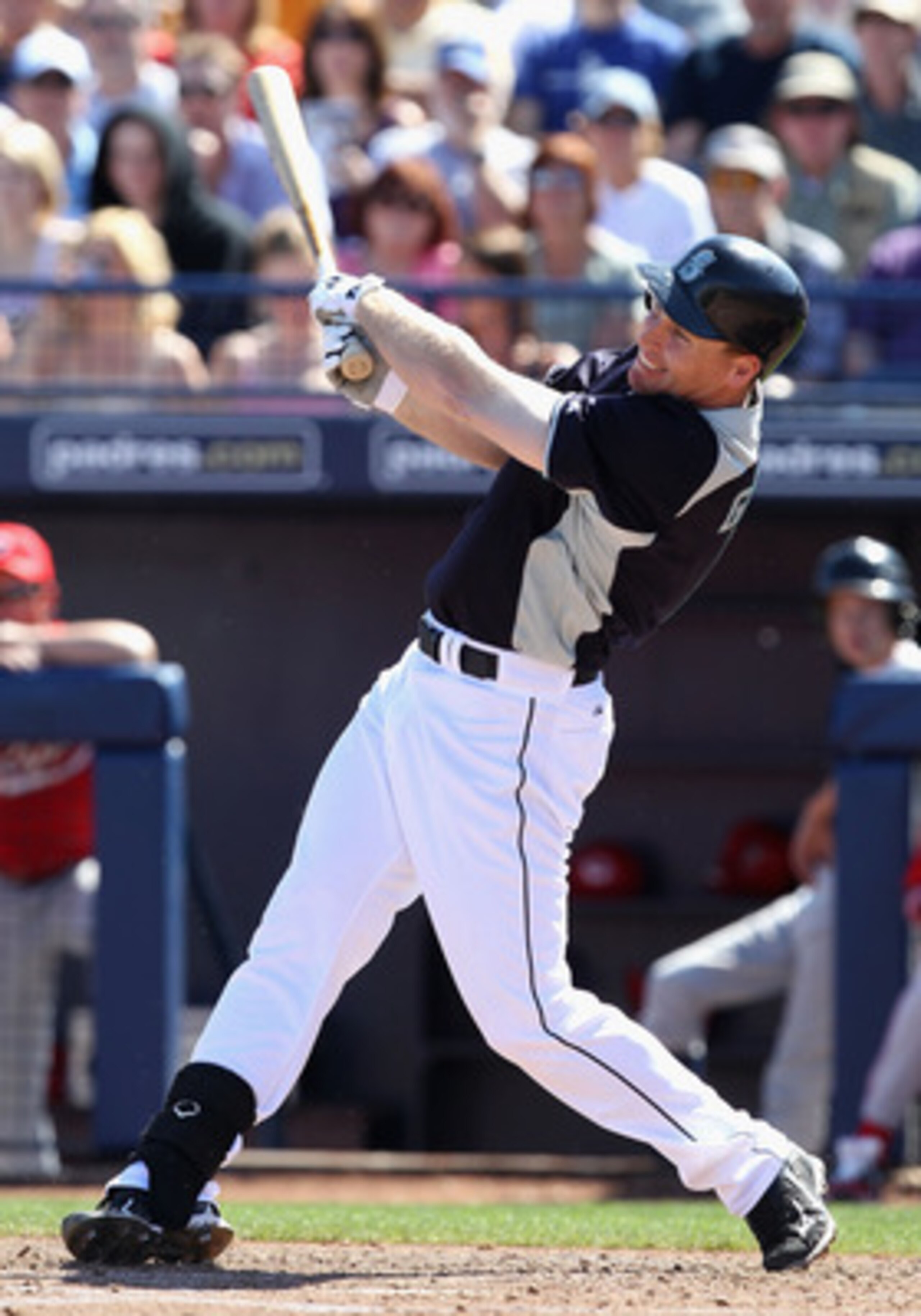 PEORIA, AZ - MARCH 04:  Justin Smoak #17 of the Seattle Mariners bats against the Cincinnati Reds during the spring training game at Peoria Stadium on March 4, 2011 in Peoria, Arizona.  (Photo by Christian Petersen/Getty Images)