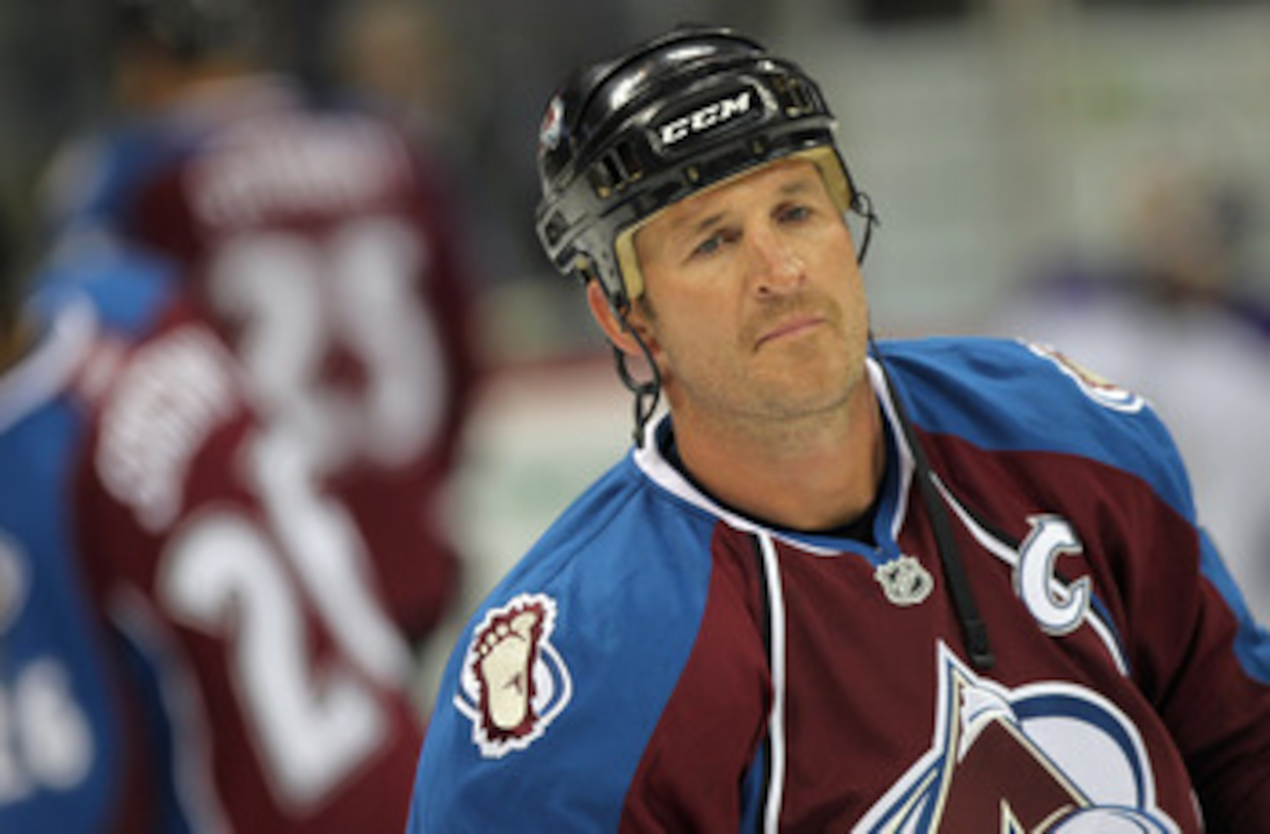 DENVER - SEPTEMBER 22:  Adam Foote #52 of the Colorado Avalanche skates during warm up prior to facing the Los Angeles Kings during preseason NHL action at the Pepsi Center on September 22, 2010 in Denver, Colorado. The Kings defeated the Avalanche 4-2.  