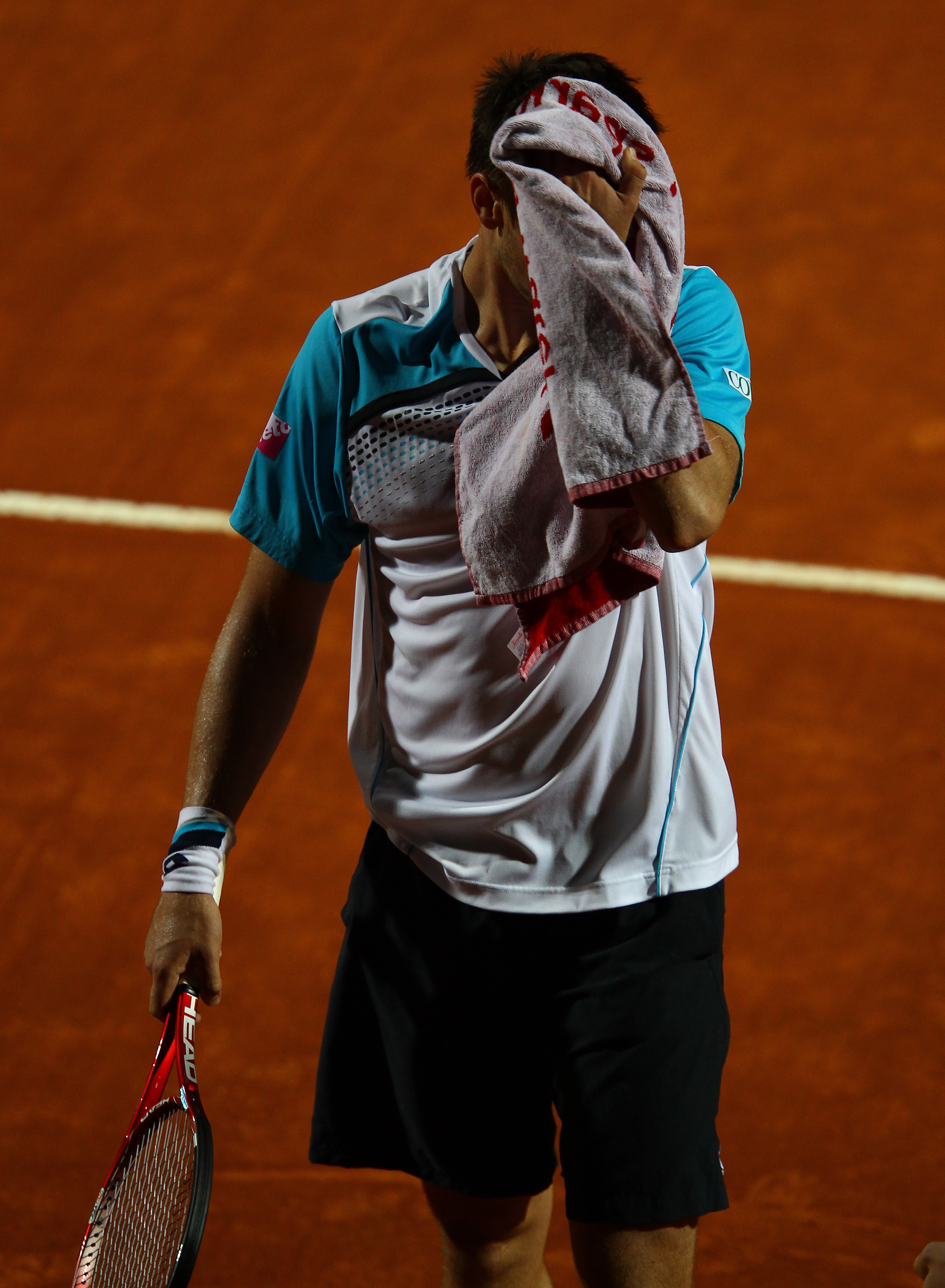 ROME, ITALY - MAY 13: Robin Soderling of Sweden shows his dejection during his straight sets defeat in his quarter final match by Novak Djokovic of Serbia during day six of the Internazoinali BNL D'Italia at the Foro Italico Tennis Centre  on May 13, 2011