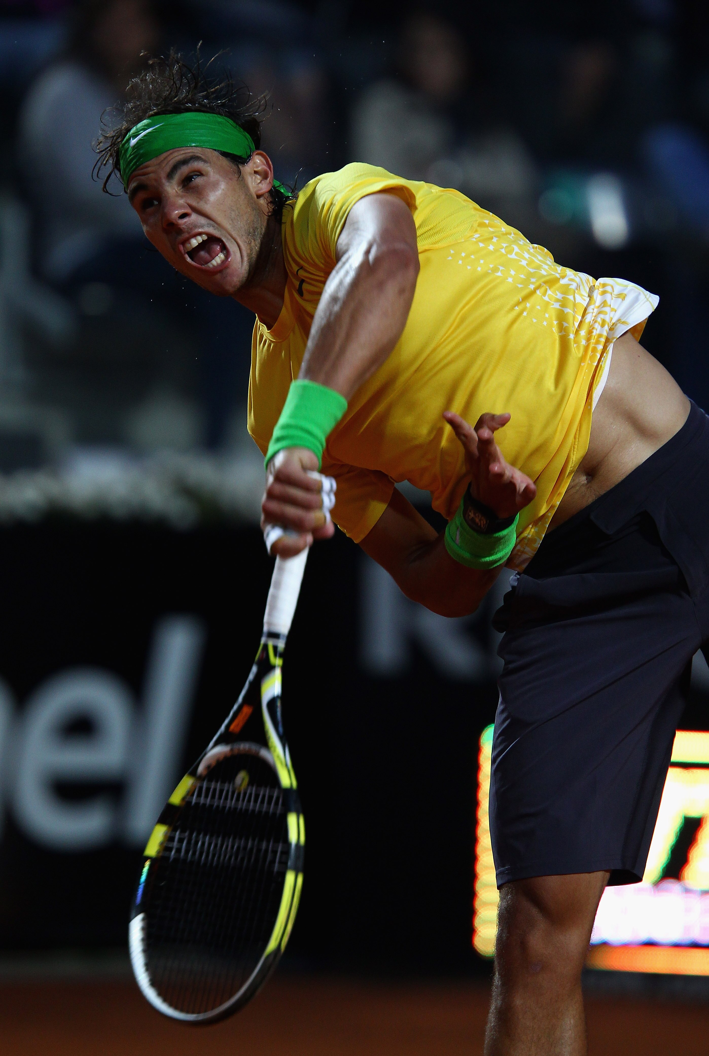 ROME, ITALY - MAY 15:  Rafael Nadal of Spain serves during the final against Novak Djokovic of Serbia during day eight of the Internazoinali BNL D'Italia at the Foro Italico Tennis Centre on May 15, 2011 in Rome, Italy.  (Photo by Clive Brunskill/Getty Im