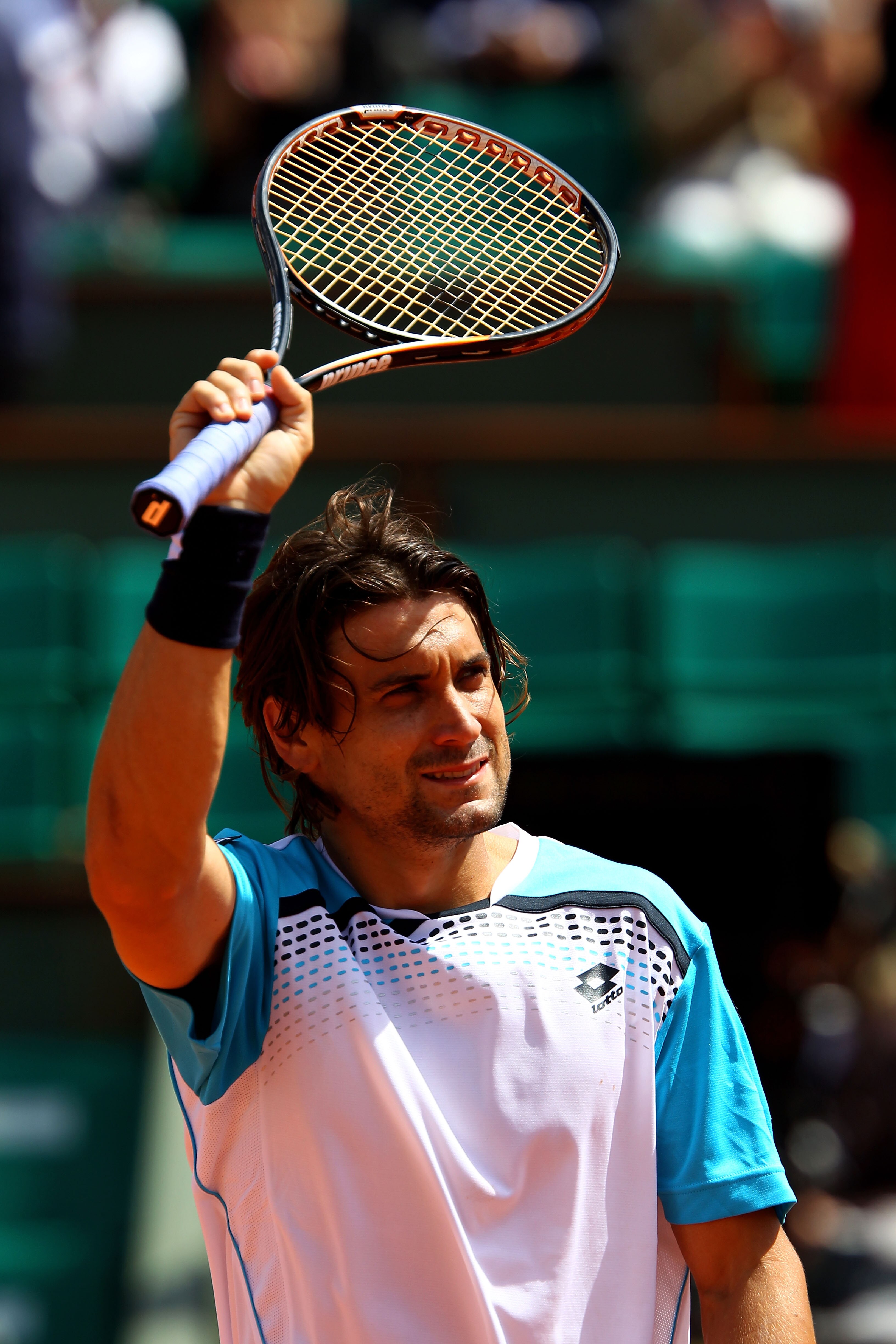 PARIS, FRANCE - MAY 22:  David Ferrer of Spain celebrates match point during the men's singles round one match  between David Ferrer of Spain and Jarkko Nieminen of Finland on day one of the French Open at Roland Garros on May 22, 2011 in Paris, France.
