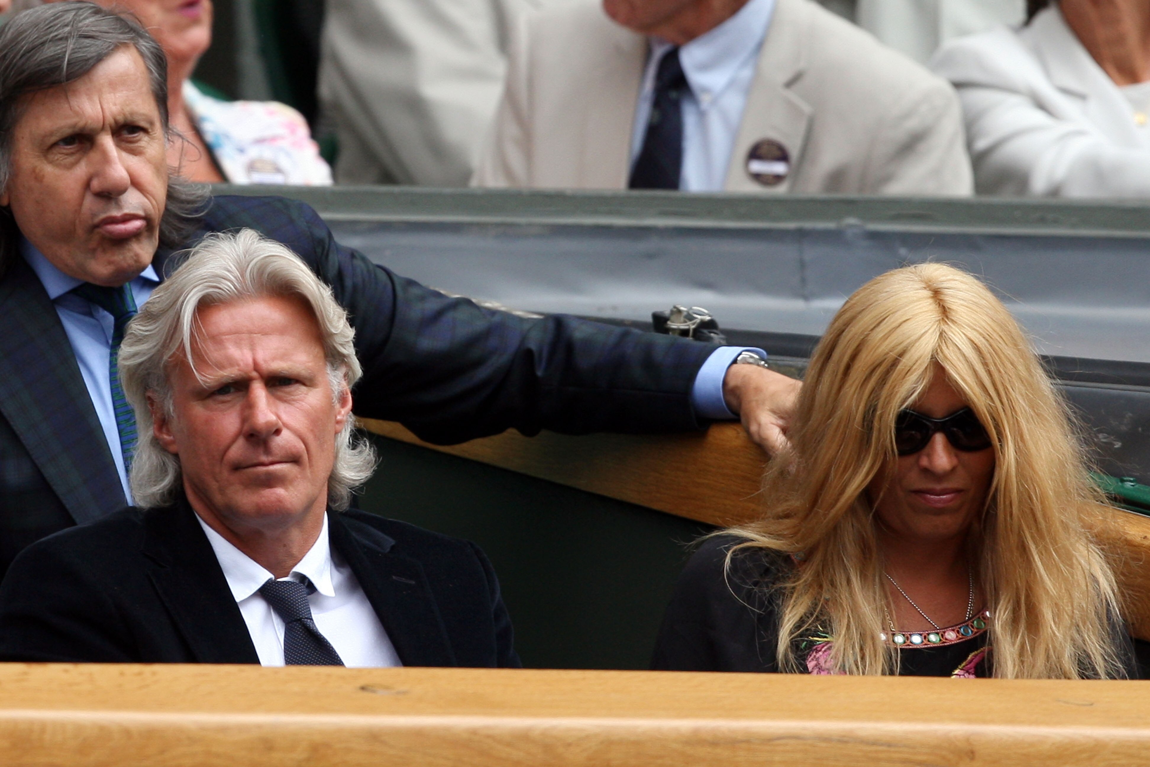 WIMBLEDON, ENGLAND - JULY 03:  Ilie Nastase (L), Bjorn Borg (C) and wife his Patricia (R) look on from Centre Court on Day Eleven of the Wimbledon Lawn Tennis Championships at the All England Lawn Tennis and Croquet Club on July 3, 2009 in London, England