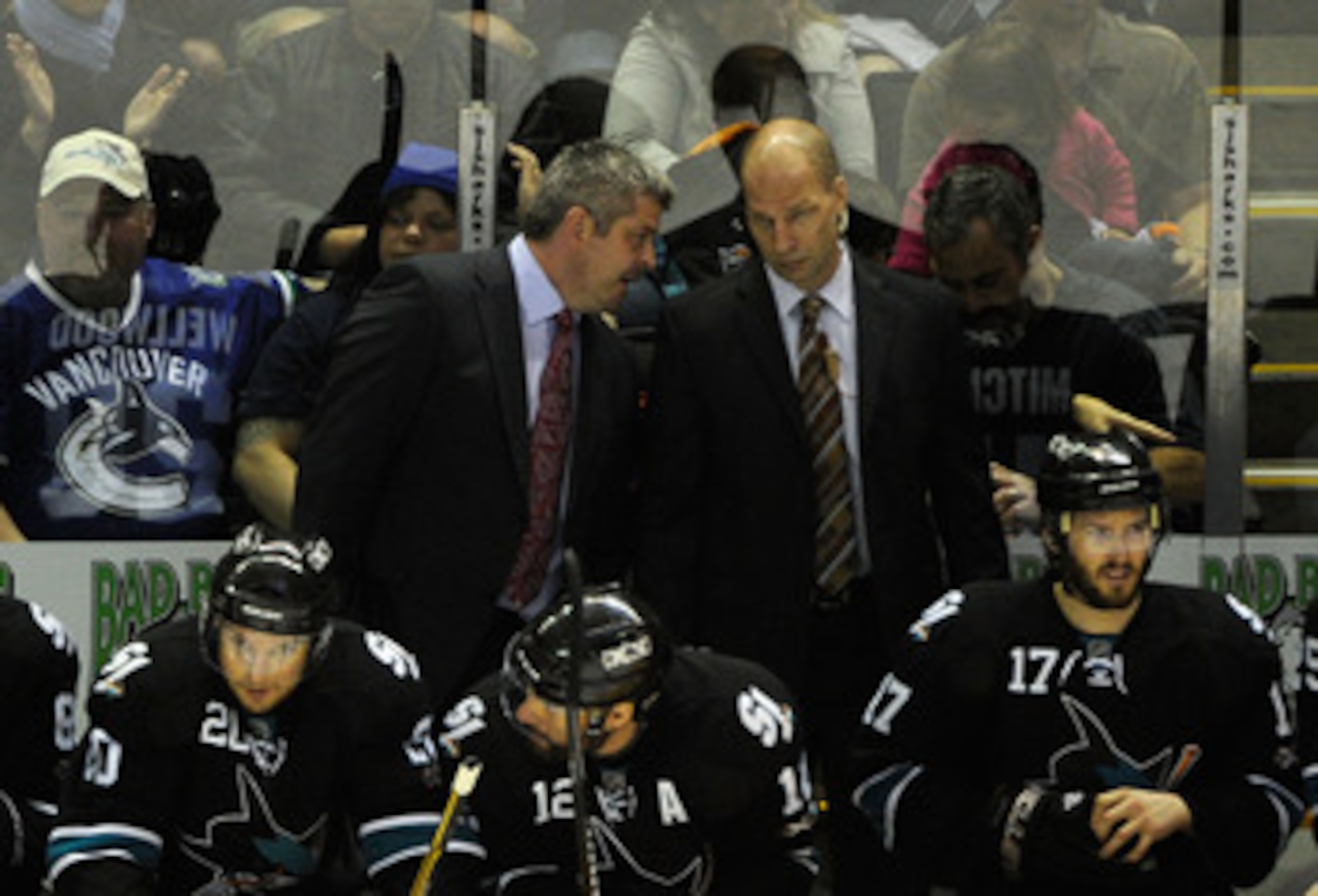 SAN JOSE, CA - MAY 22:  Head Coach Todd McLellan and Assistant Coach Matt Shaw of the San Jose Sharks confer on the benc during Game Four of the Western Conference Finals between the Vancouver Canucks and the San Jose Sharks during the 2011 Stanley Cup Pl