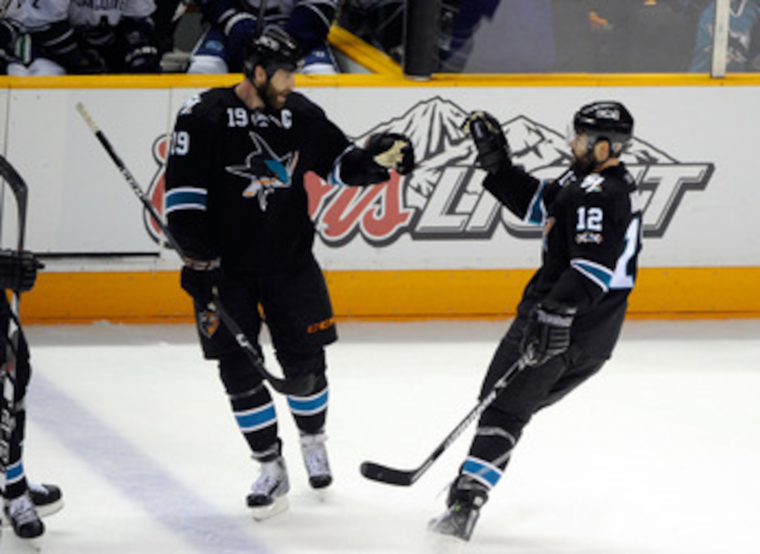 SAN JOSE, CA - MAY 20:  Joe Thornton #19 and Patrick Marleau #12 of the San Jose Sharks celebrate Marleau's second goal of the first period in Game Three of the Western Conference Finals during the 2011 Stanley Cup Playoffs at HP Pavilion on May 20, 2011