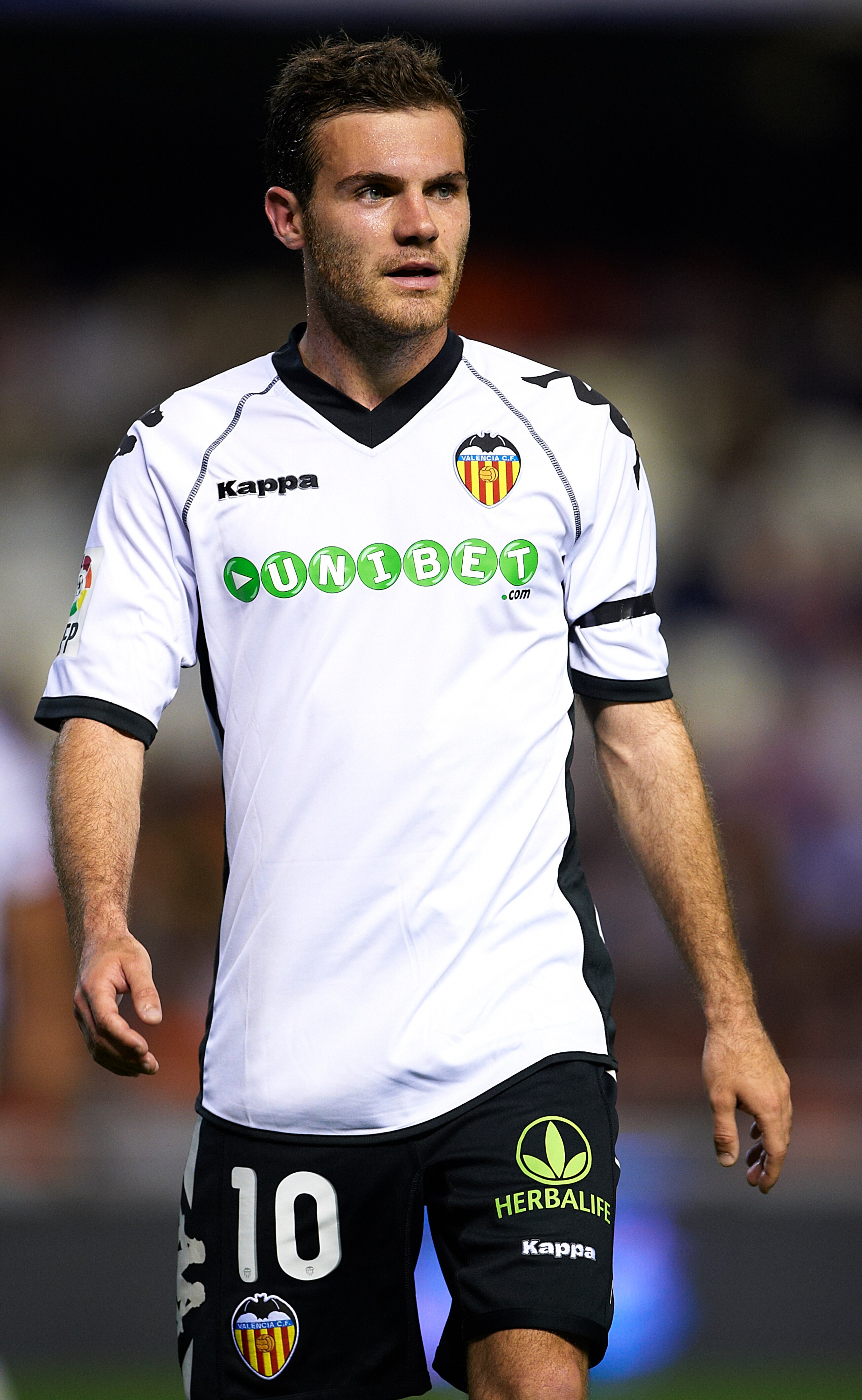 VALENCIA, SPAIN - APRIL 10:  Juan Mata of Valencia looks on during the La Liga match between Valencia and Villarreal at Estadio Mestalla on April 10, 2011 in Valencia, Spain.  Valencia won 5-0.  (Photo by Manuel Queimadelos Alonso/Getty Images)