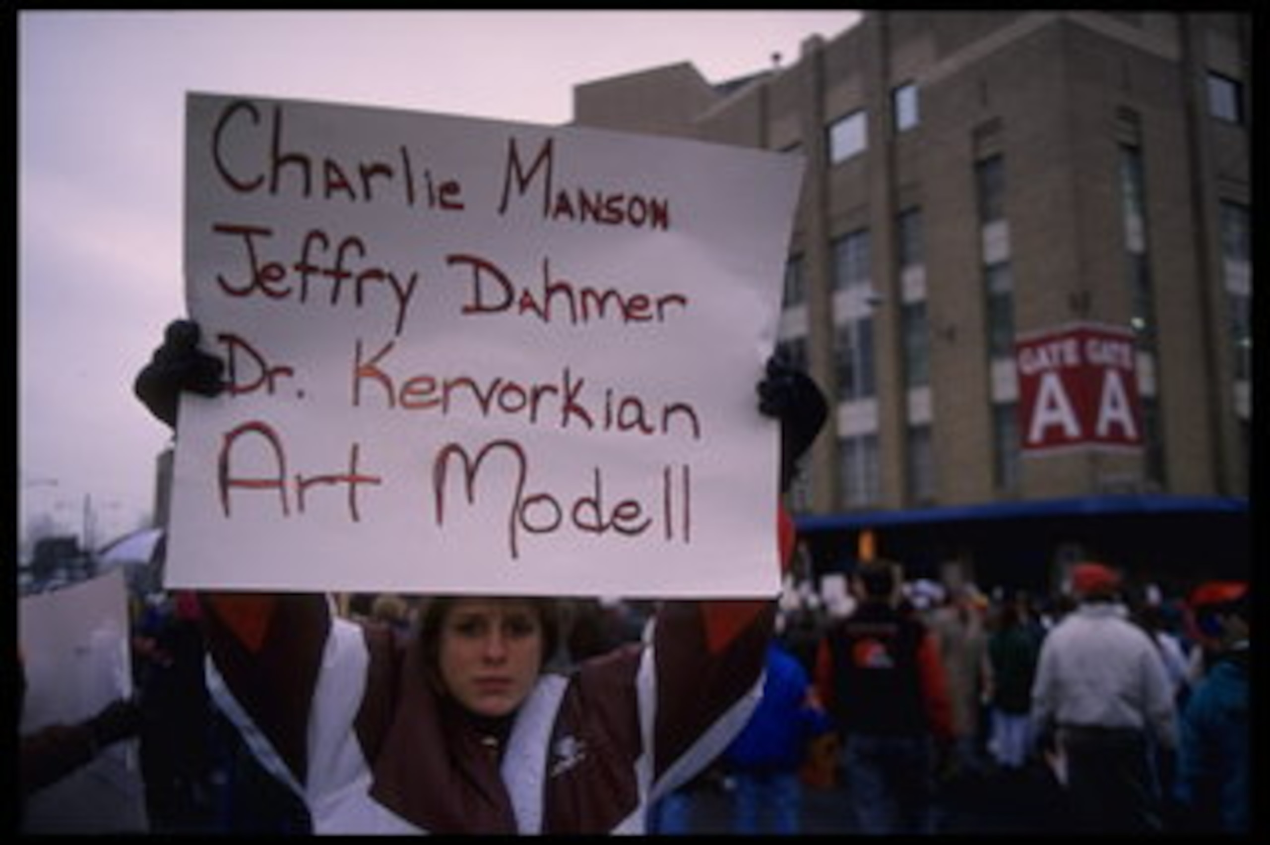 19 Nov 1995: Fans hold various signs which accuse Cleveland Browns owner Art Modell of disregard of fans which compares him to famous murderers at Cleveland Stadium in Cleveland, Ohio. The Packers defeated the Browns that day 31-20.