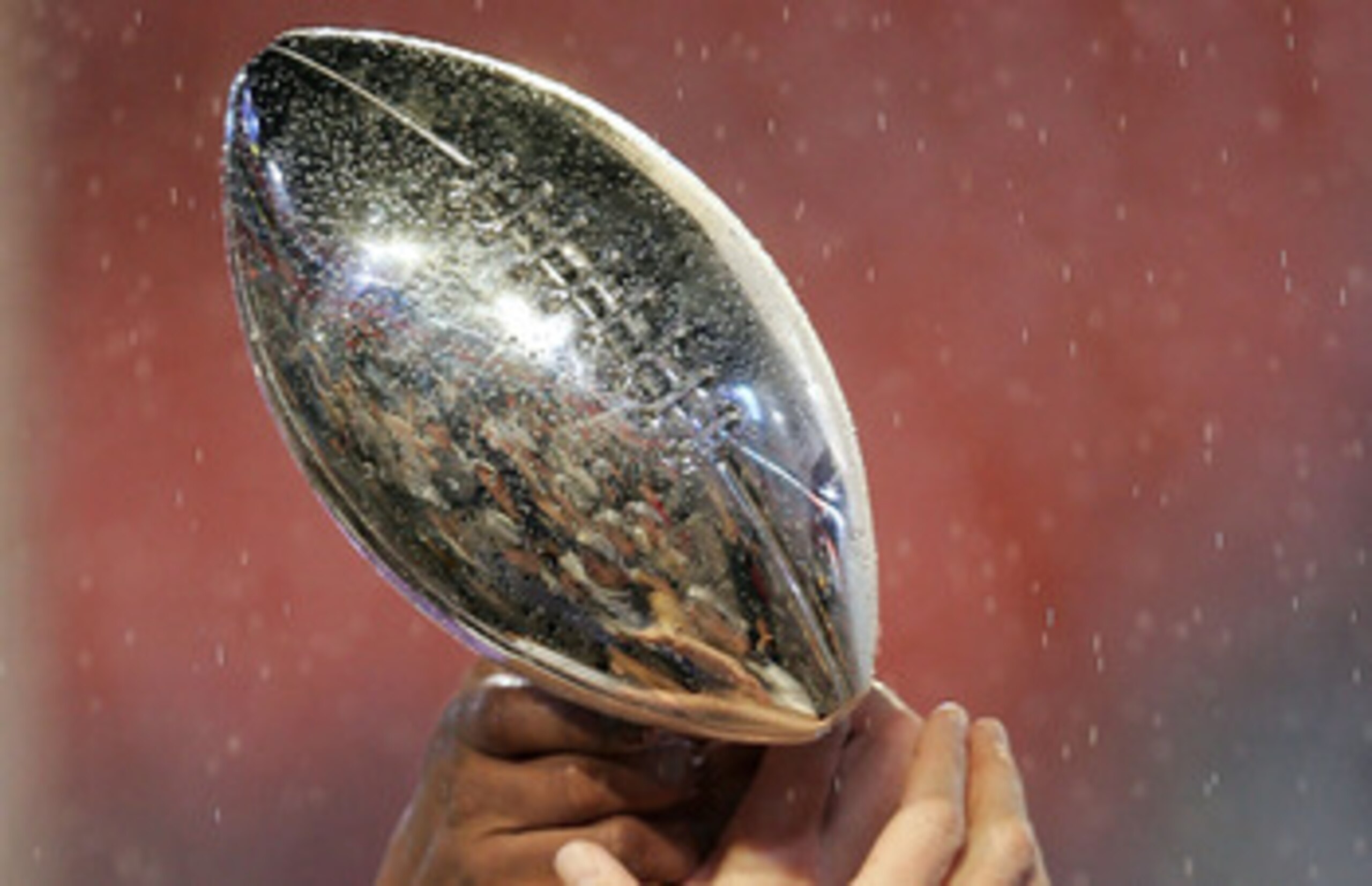 MIAMI GARDENS, FL - FEBRUARY 04:  Members of the of the Indianapolis Colts celebrate with the Vince Lonbardi Trophy after their 29-17 win the Chicago Bears in Super Bowl XLI on February 4, 2007 at Dolphin Stadium in Miami Gardens, Florida.  (Photo by Jona